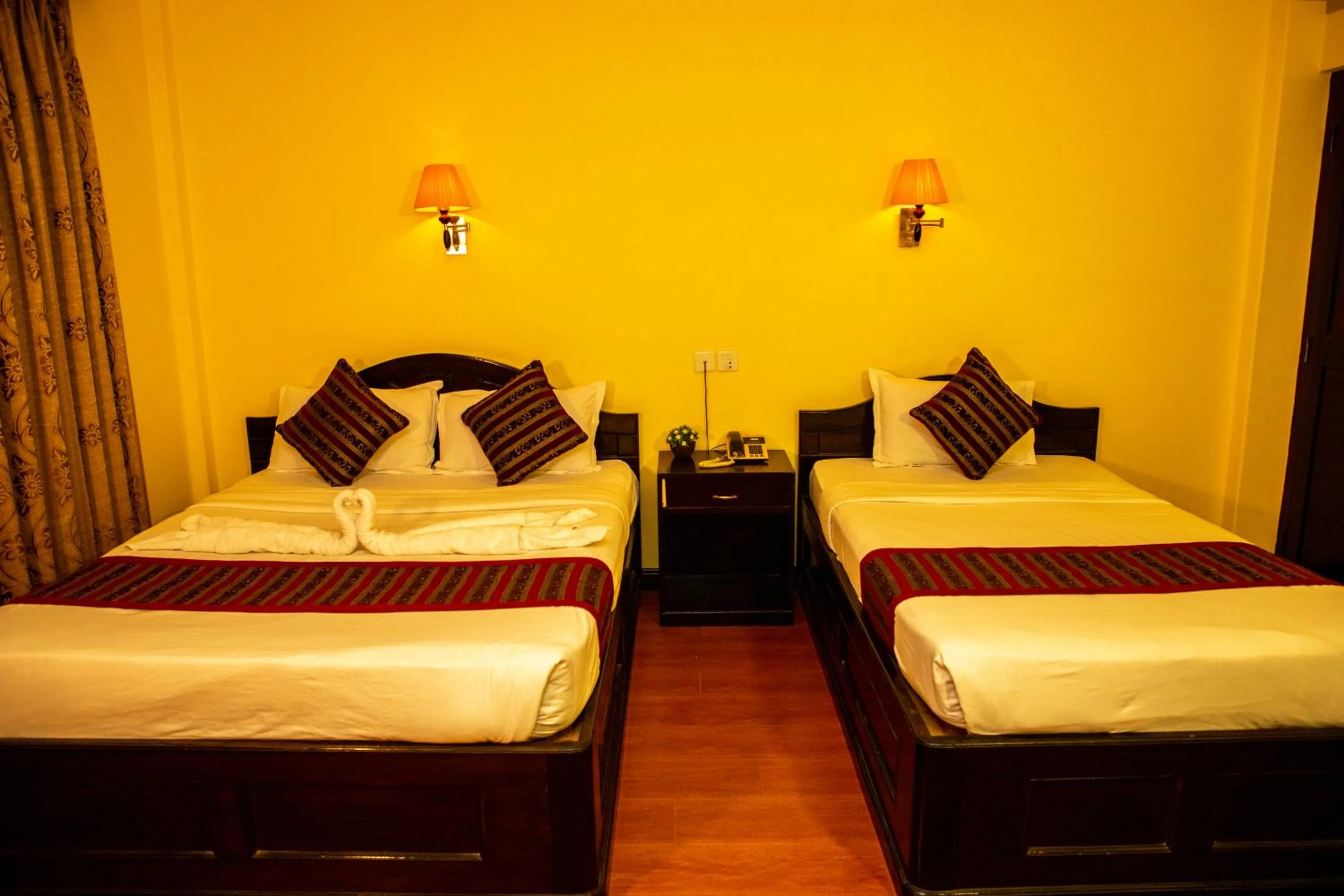 Bed in Hotel Bougainvillea