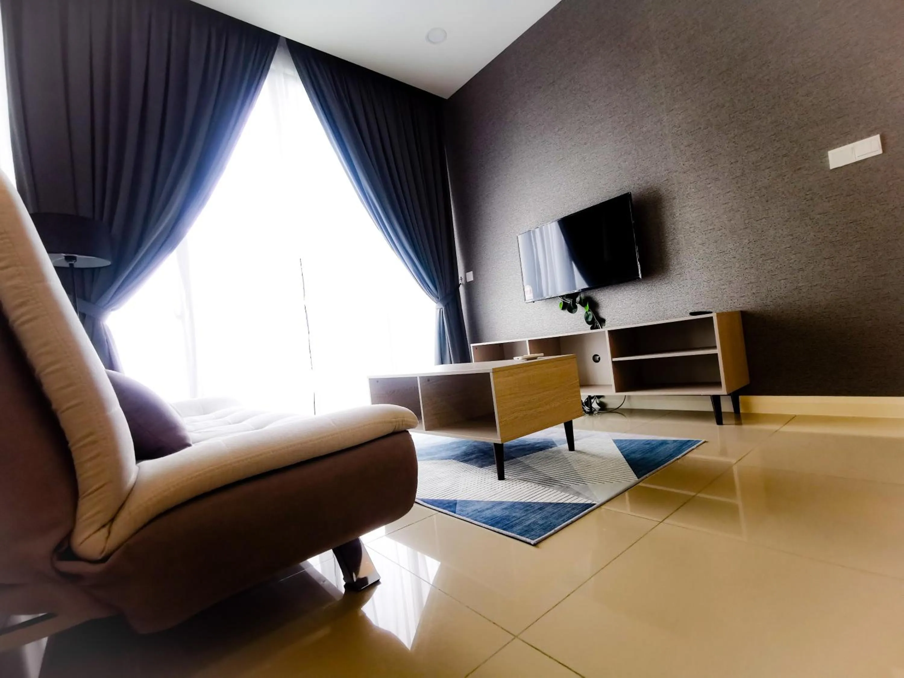 Communal lounge/ TV room in Legoland D'PRISTINE Apartment By TGP