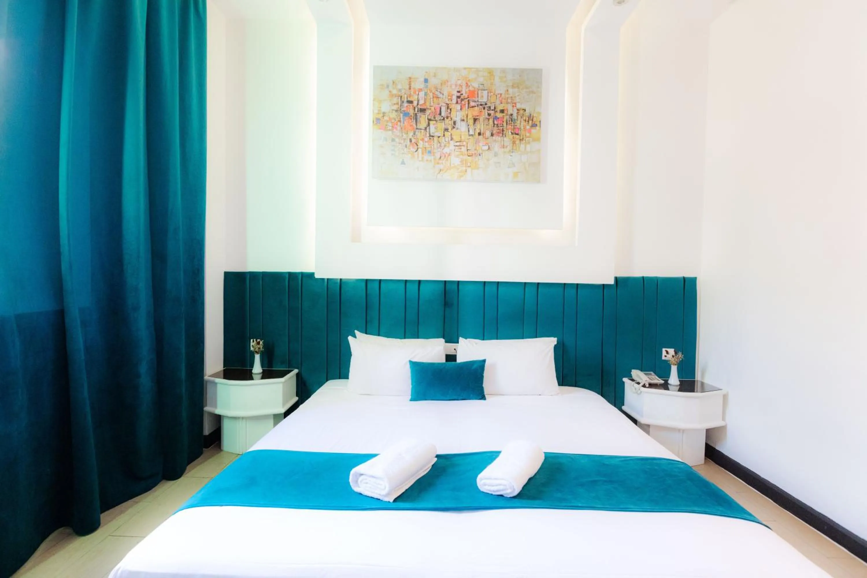 Bed in WINDSOR HOTEL CITY CENTER