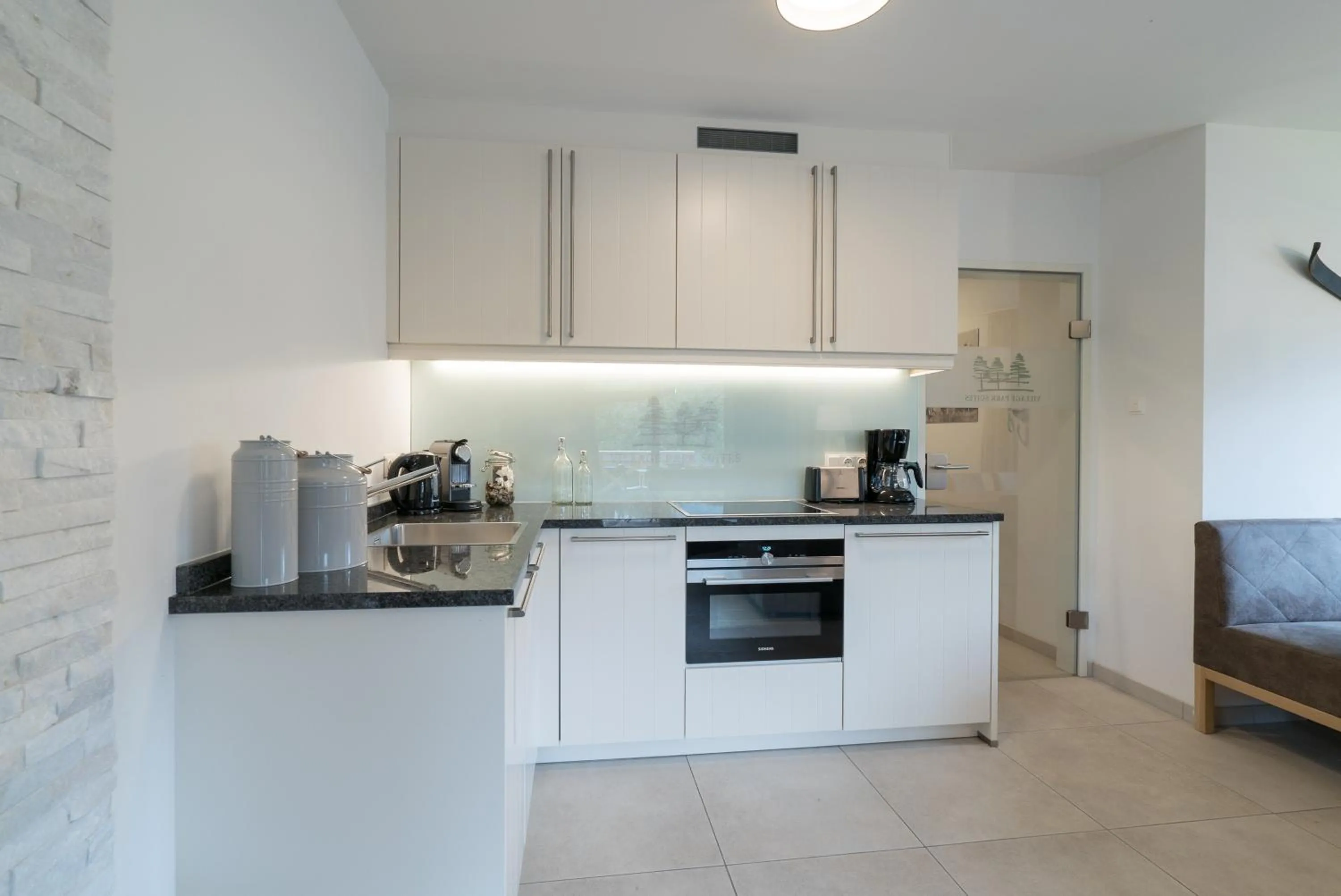 Kitchen or kitchenette in Village Park Suites