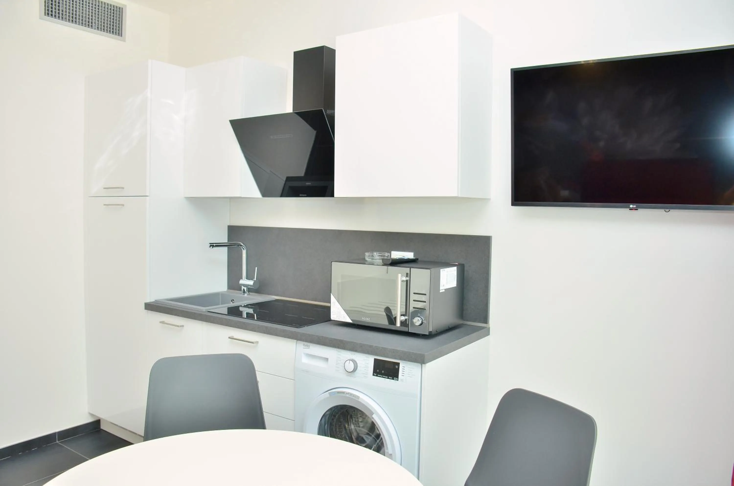 Kitchen or kitchenette in Ashanti Aparthotel Wellness&Spa