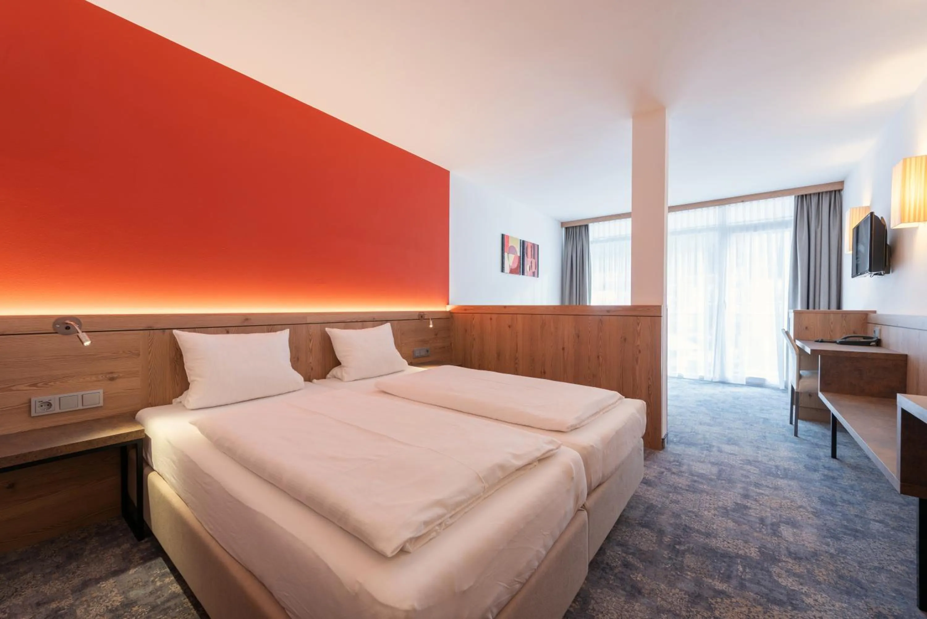 Bed in Hotel Alpenland