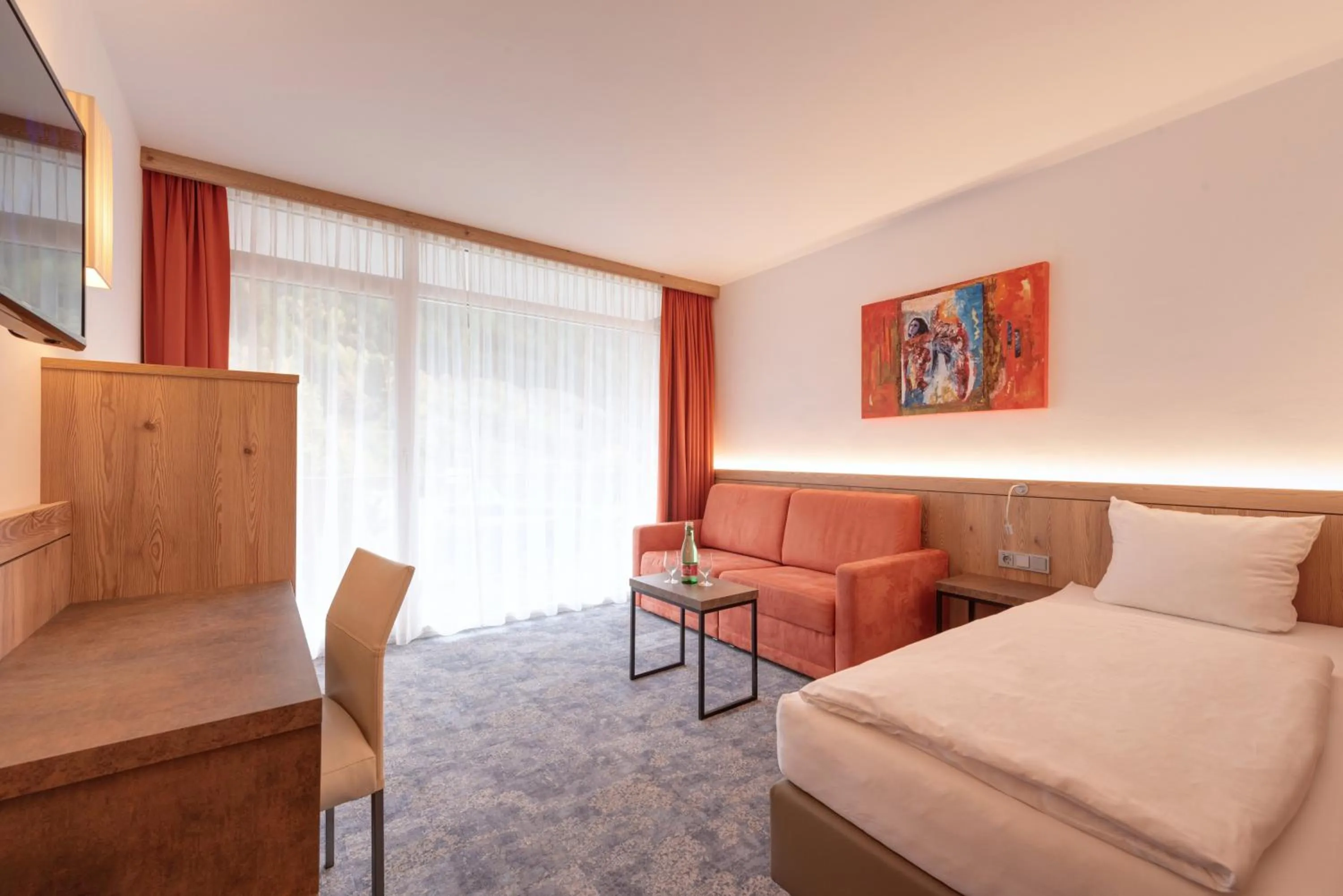 Living room, Bed in Hotel Alpenland