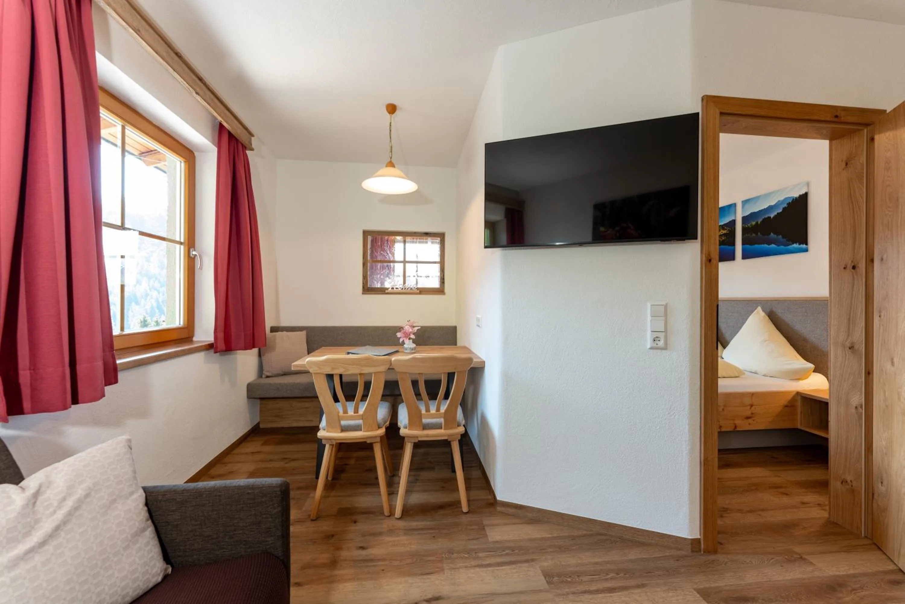 Living room, Bed in Pension Bergbauernhof Irxner