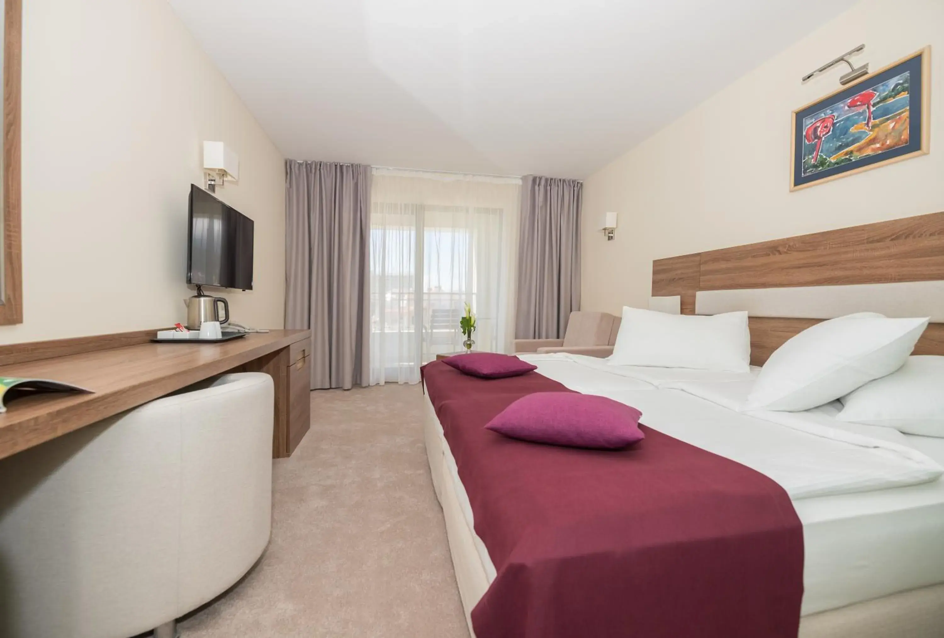 Communal lounge/ TV room, Bed in Hotel Park Makarska Communal lounge/ TV room, Bed in Hotel Park Makarska