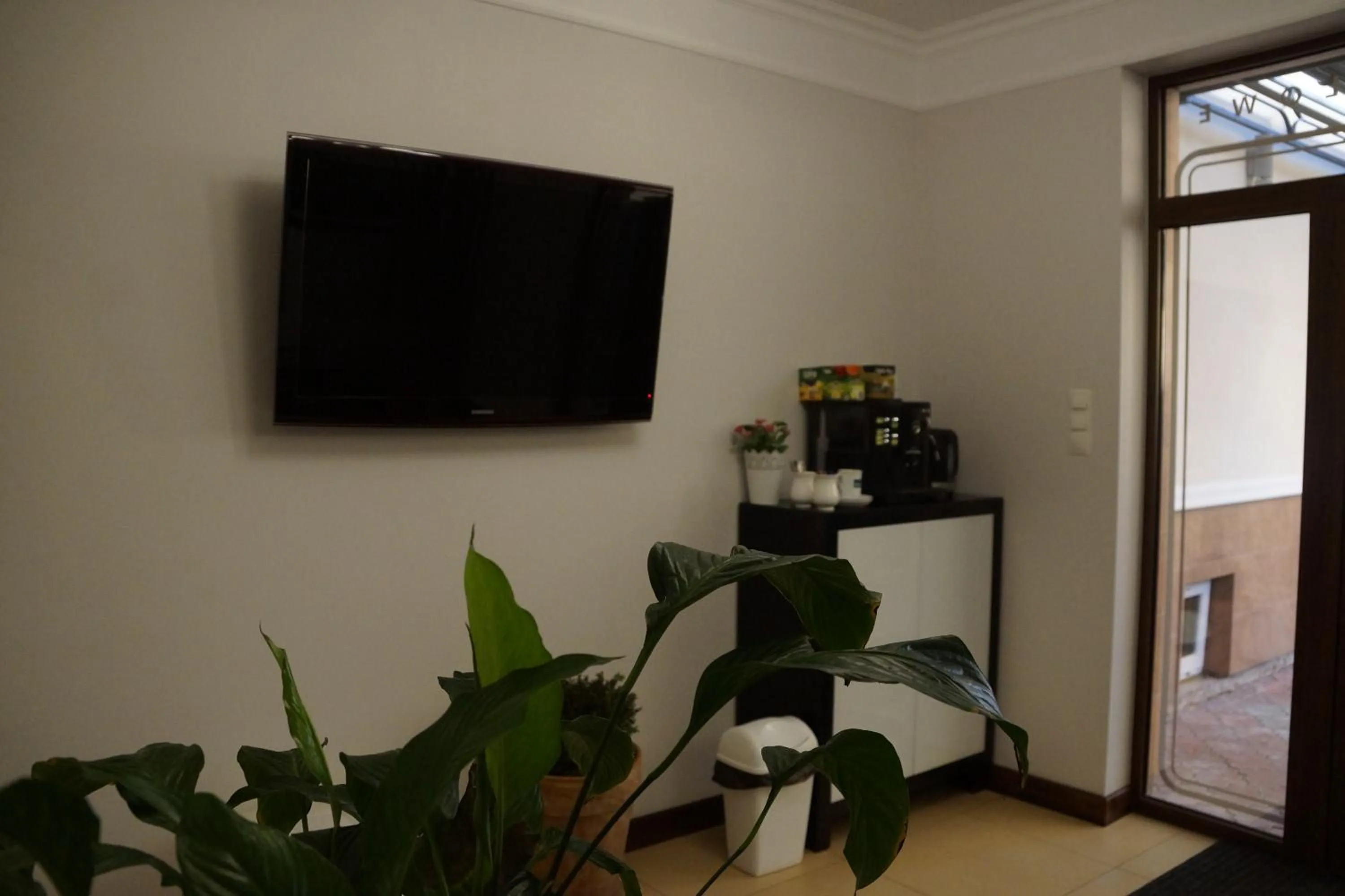 Communal lounge/ TV room in Pokoje De Luxe Figaro