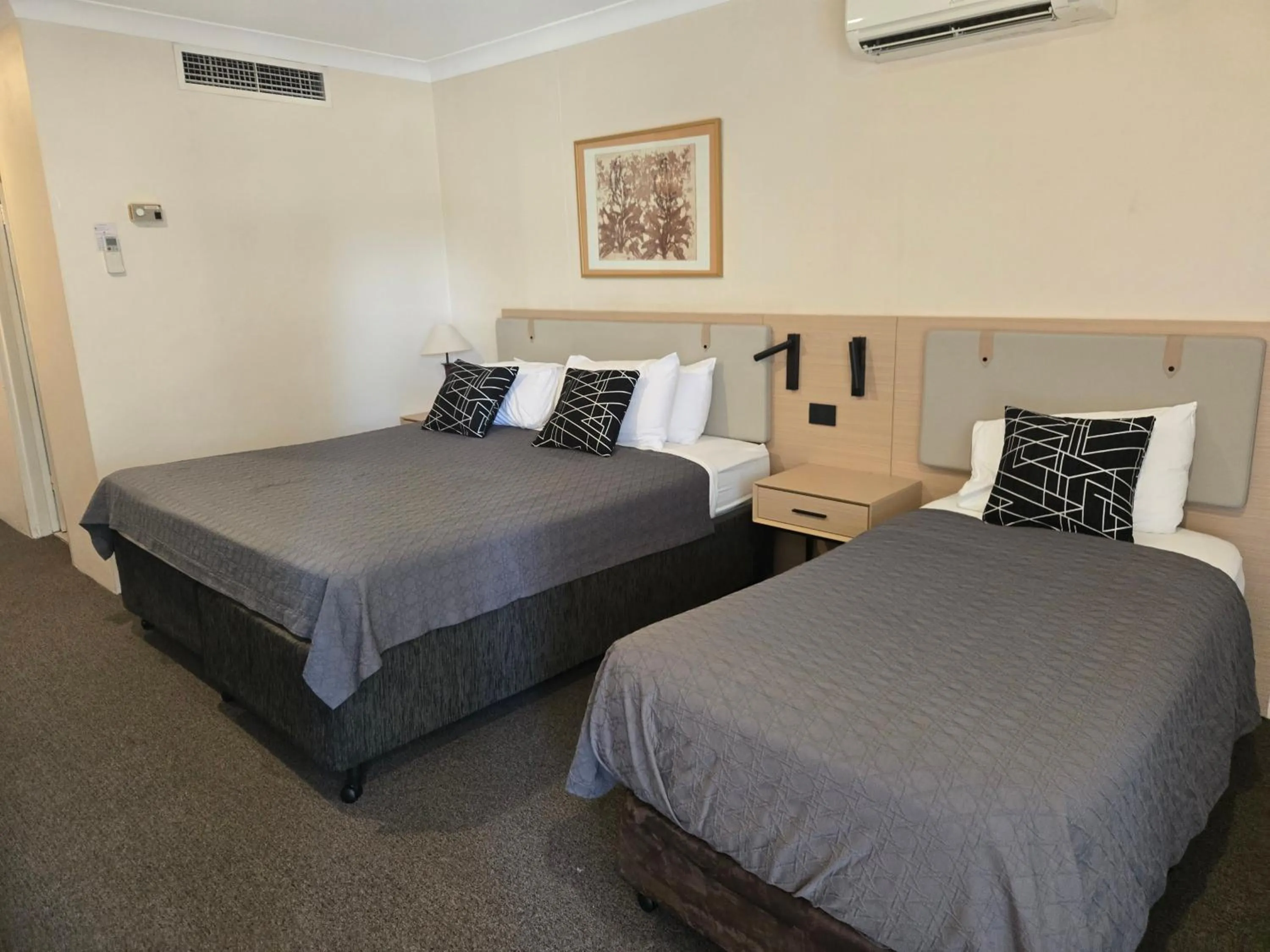 Bed in Charbonnier Motor Inn