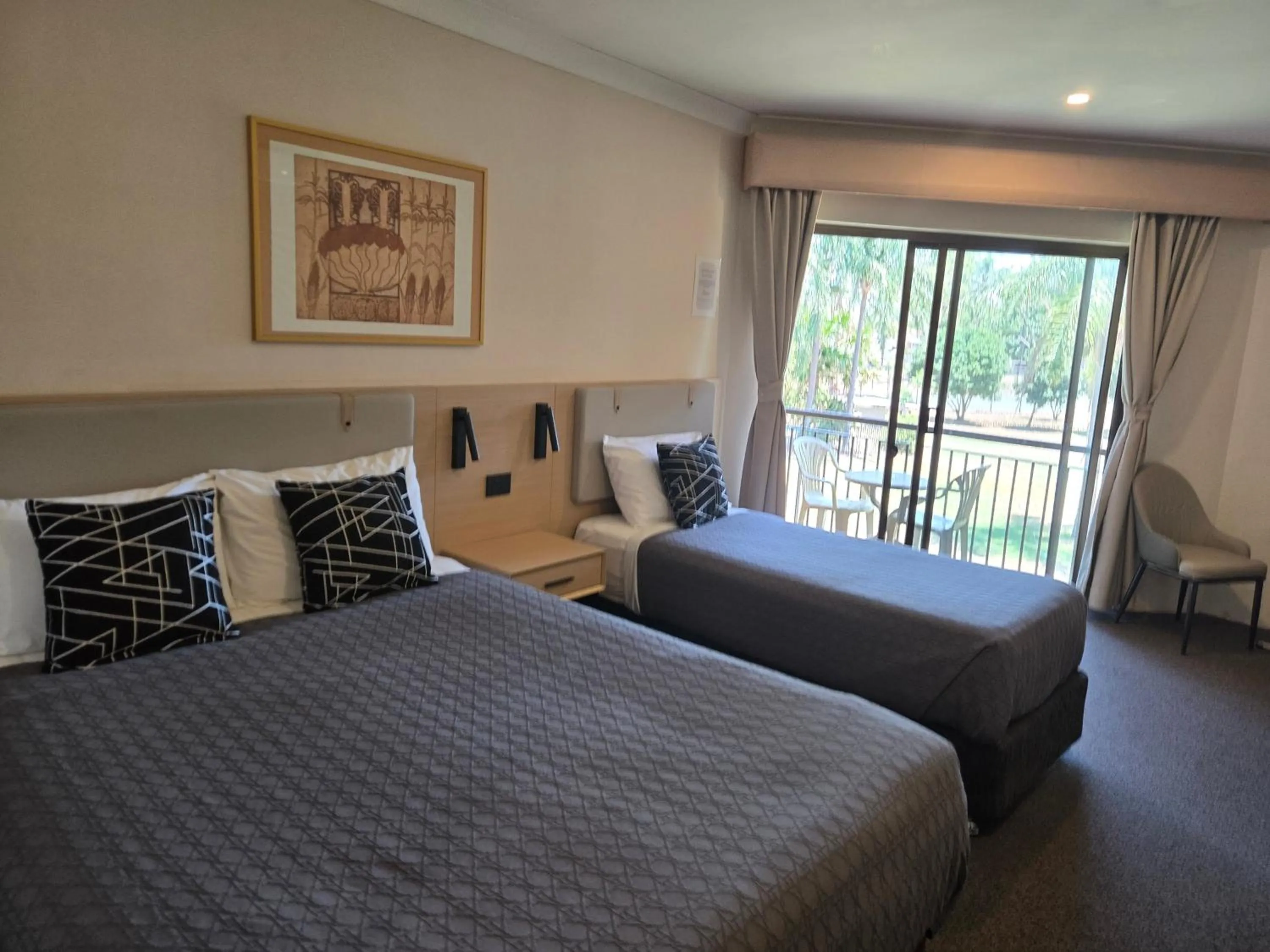 Bed in Charbonnier Motor Inn