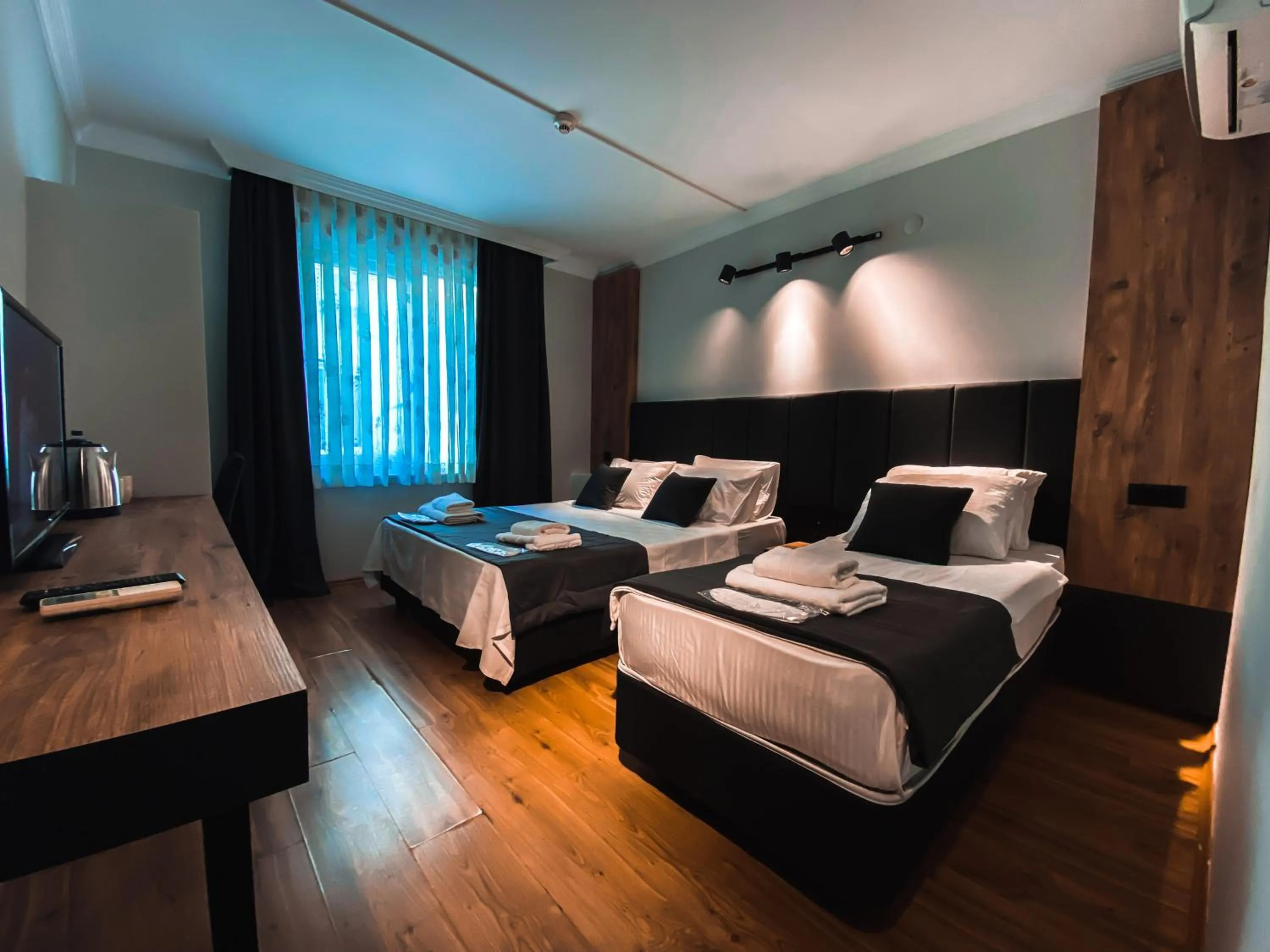 Bed in TEPE HOTEL&BUSINESS SUITE