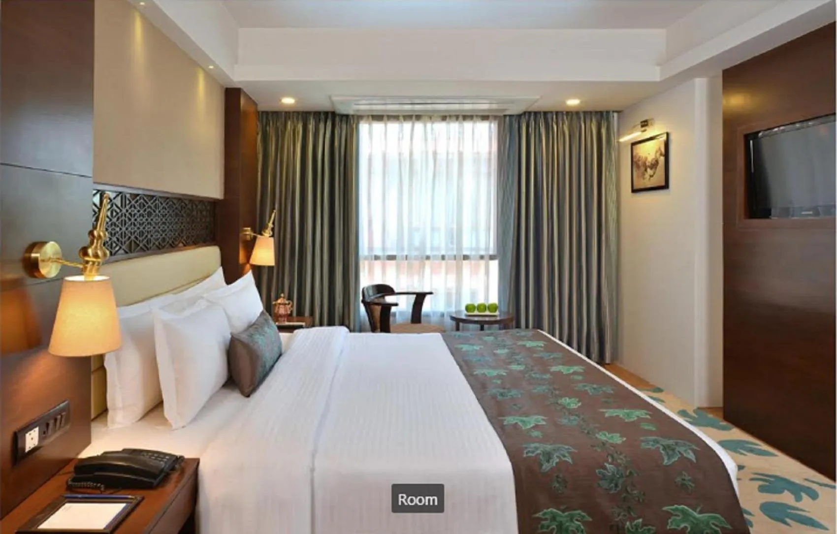 Photo of the whole room, Bed in Golden Tulip Srinagar