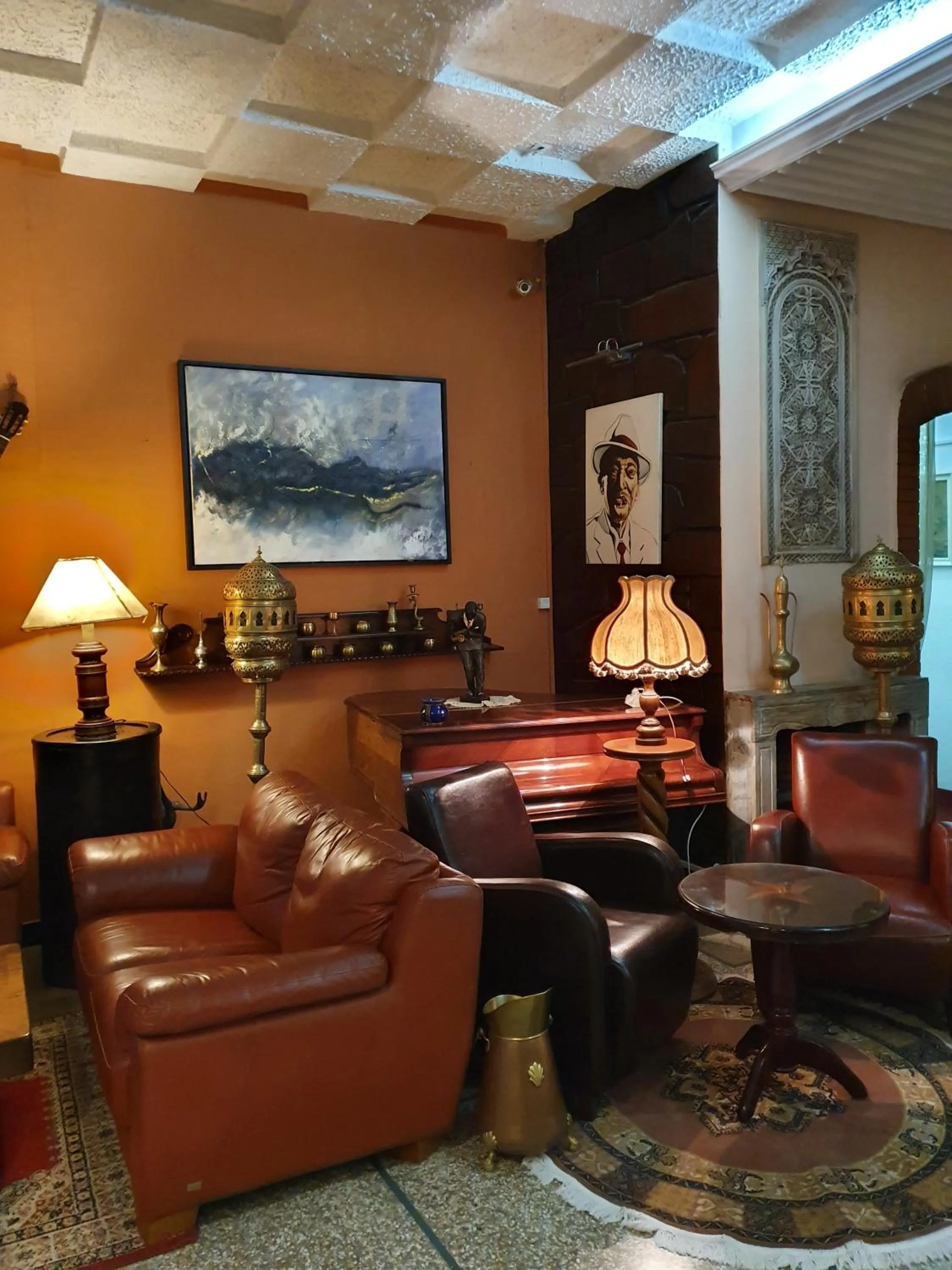 Communal lounge/ TV room in Ambassy Hotel