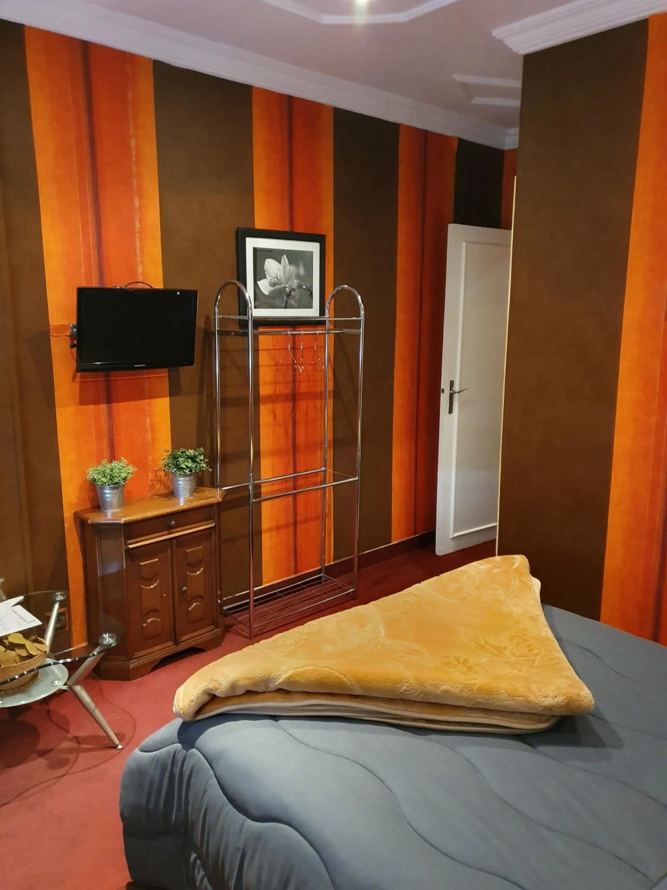 Bed in Ambassy Hotel