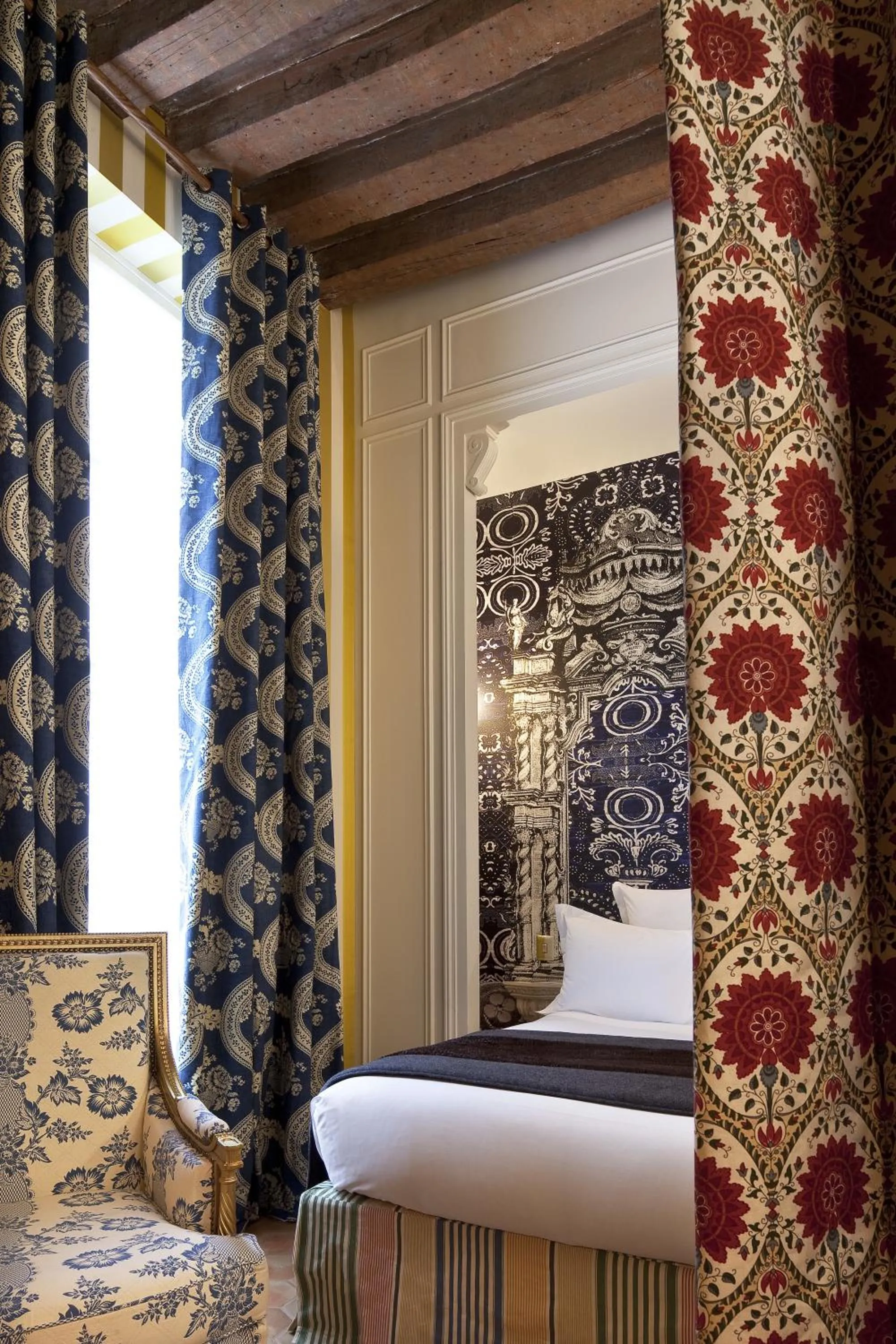 Bed in Hôtel du Petit Moulin, Haute Couture hotel by Lacroix