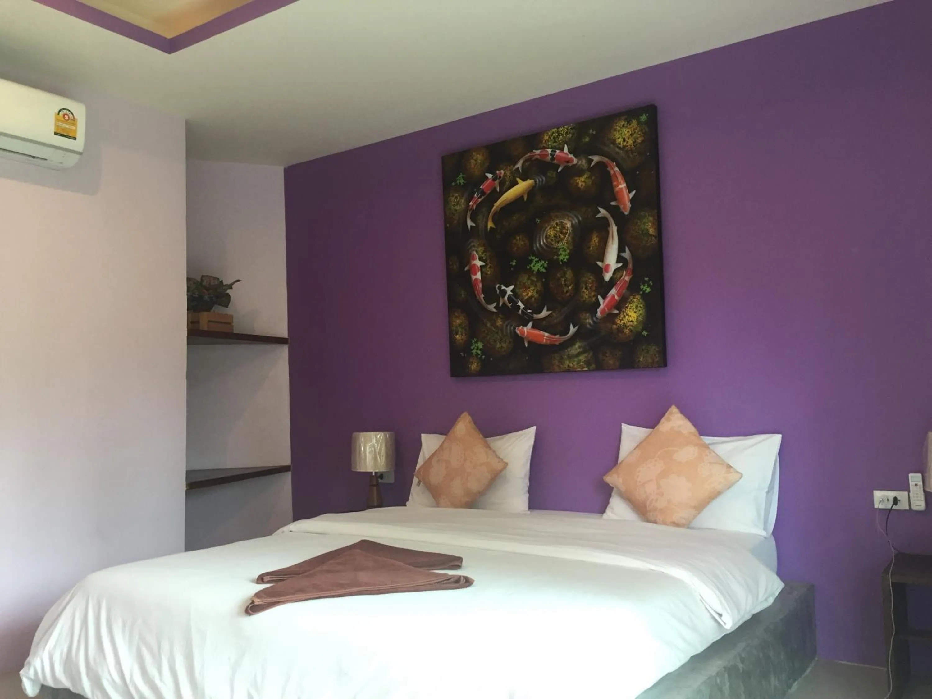 Bed in Baan Suan Ta Hotel