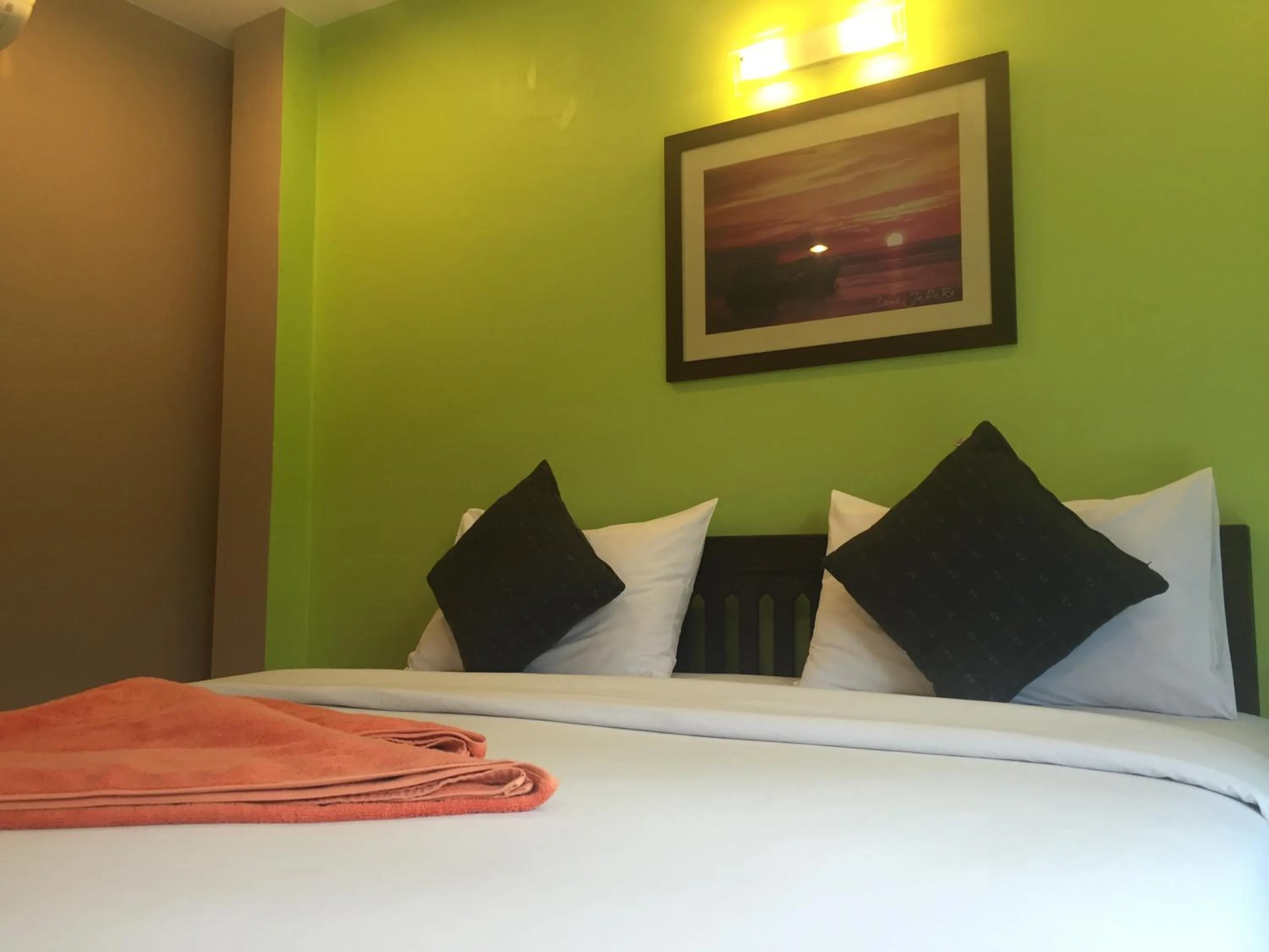 Bed in Baan Suan Ta Hotel