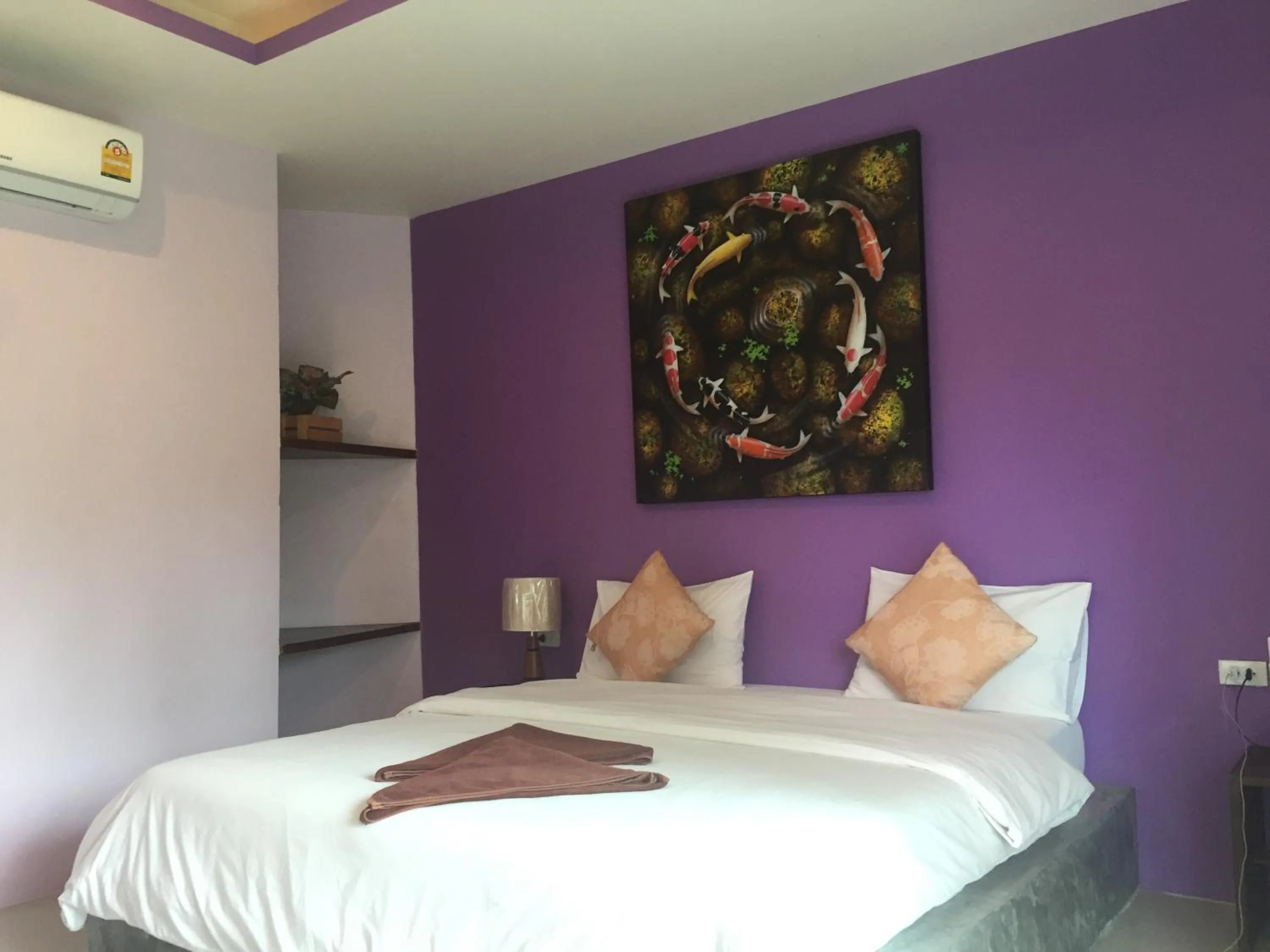 Bed in Baan Suan Ta Hotel