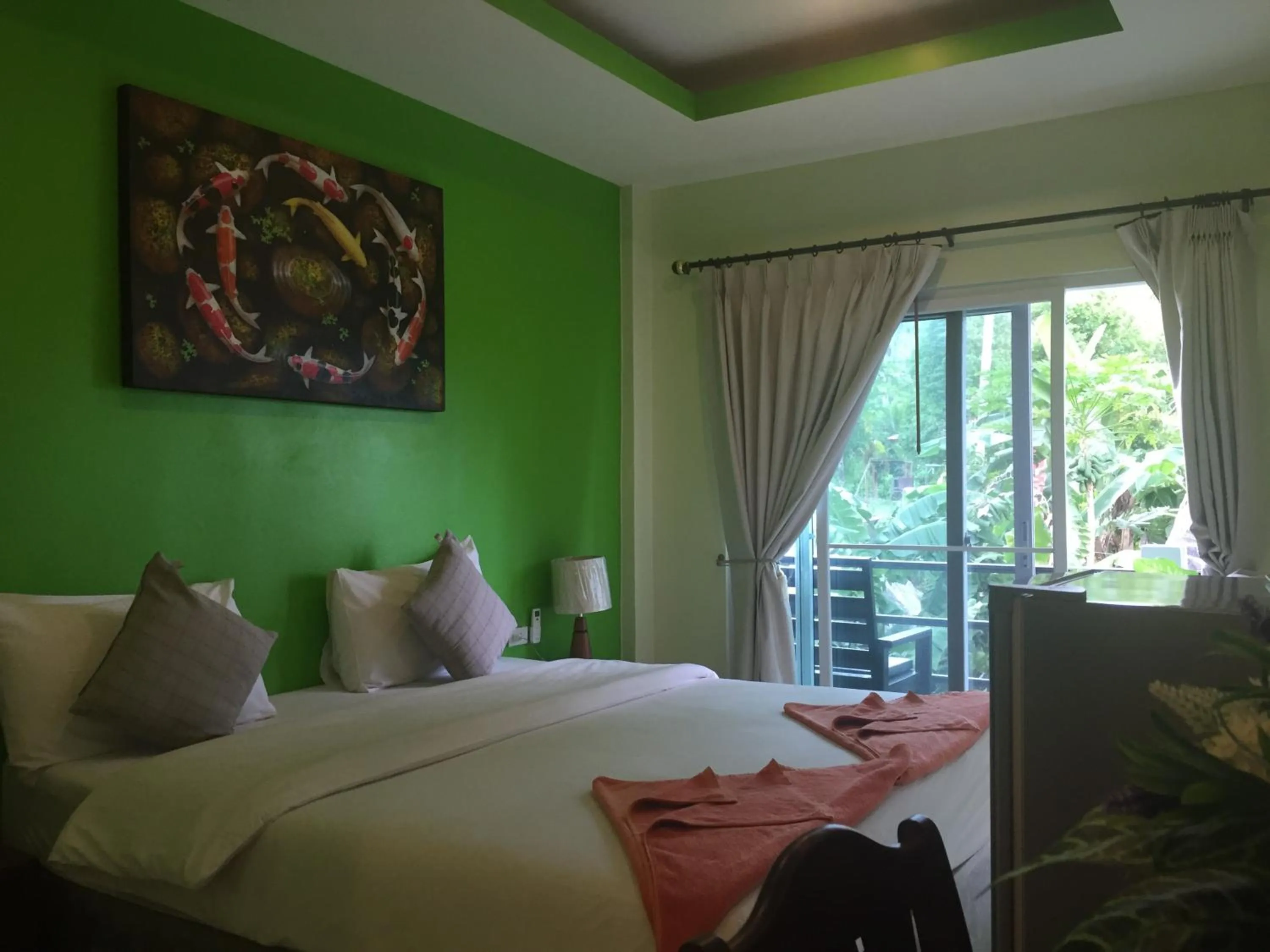 Bed in Baan Suan Ta Hotel