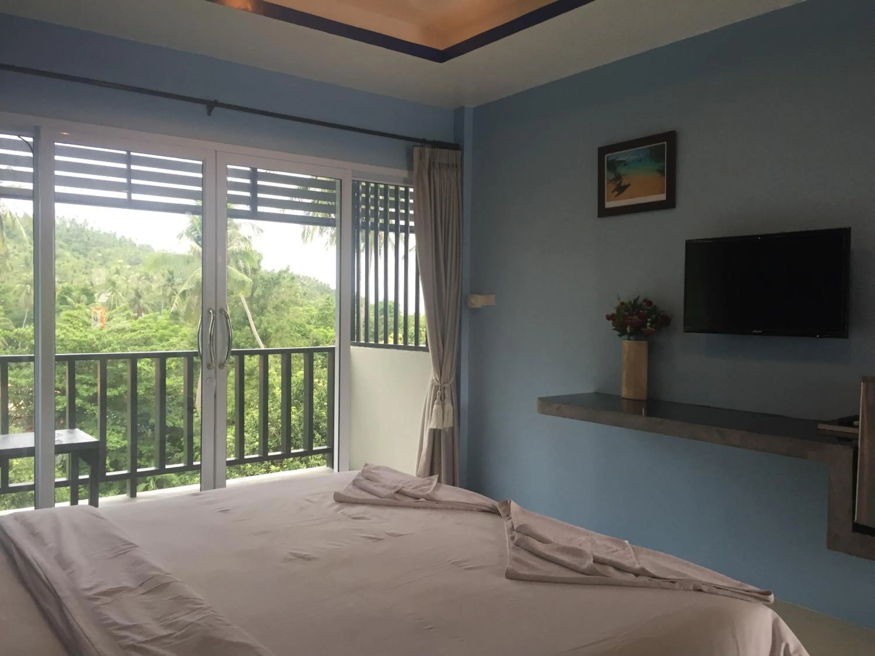 Bed in Baan Suan Ta Hotel