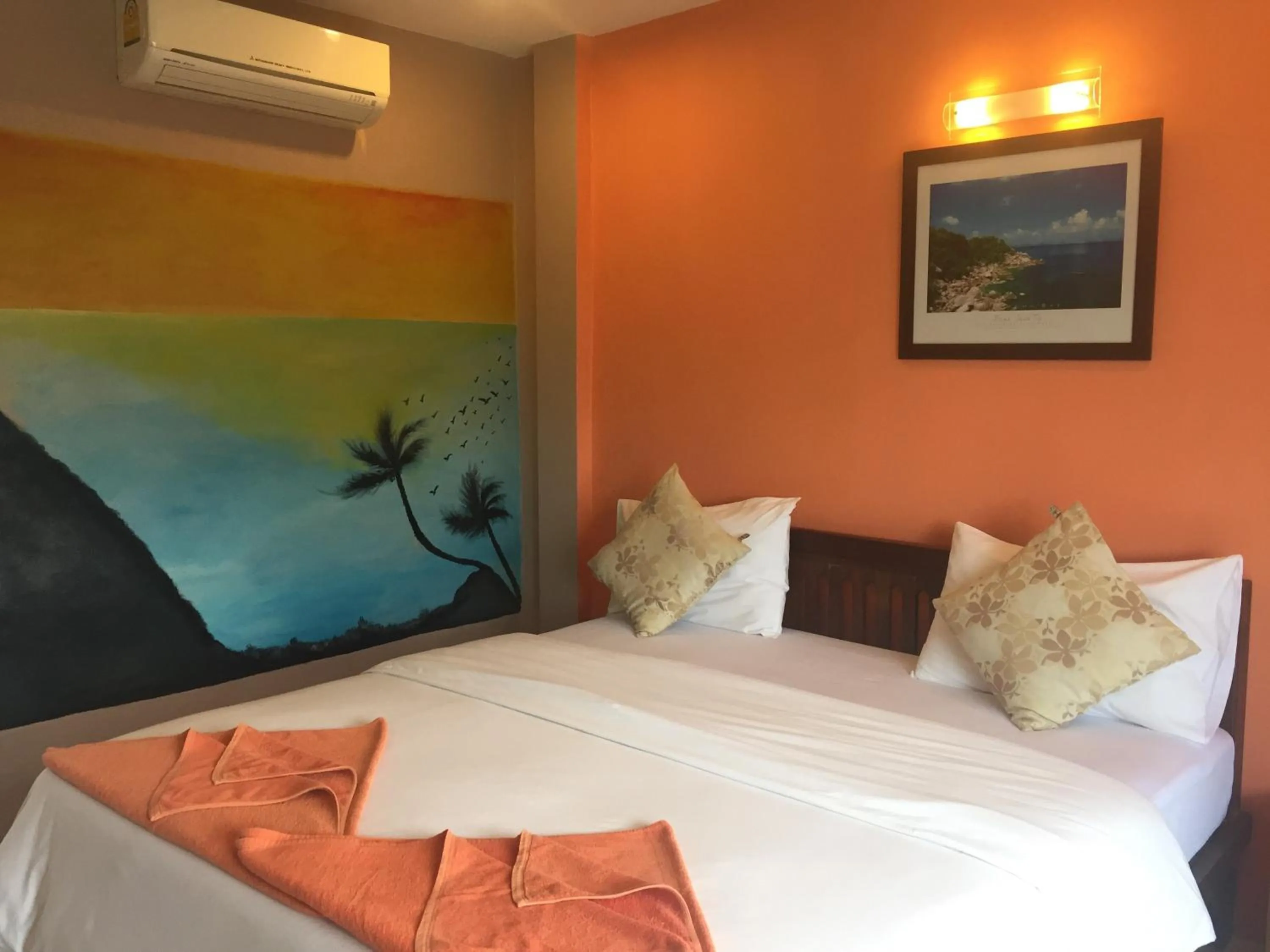 Bed in Baan Suan Ta Hotel