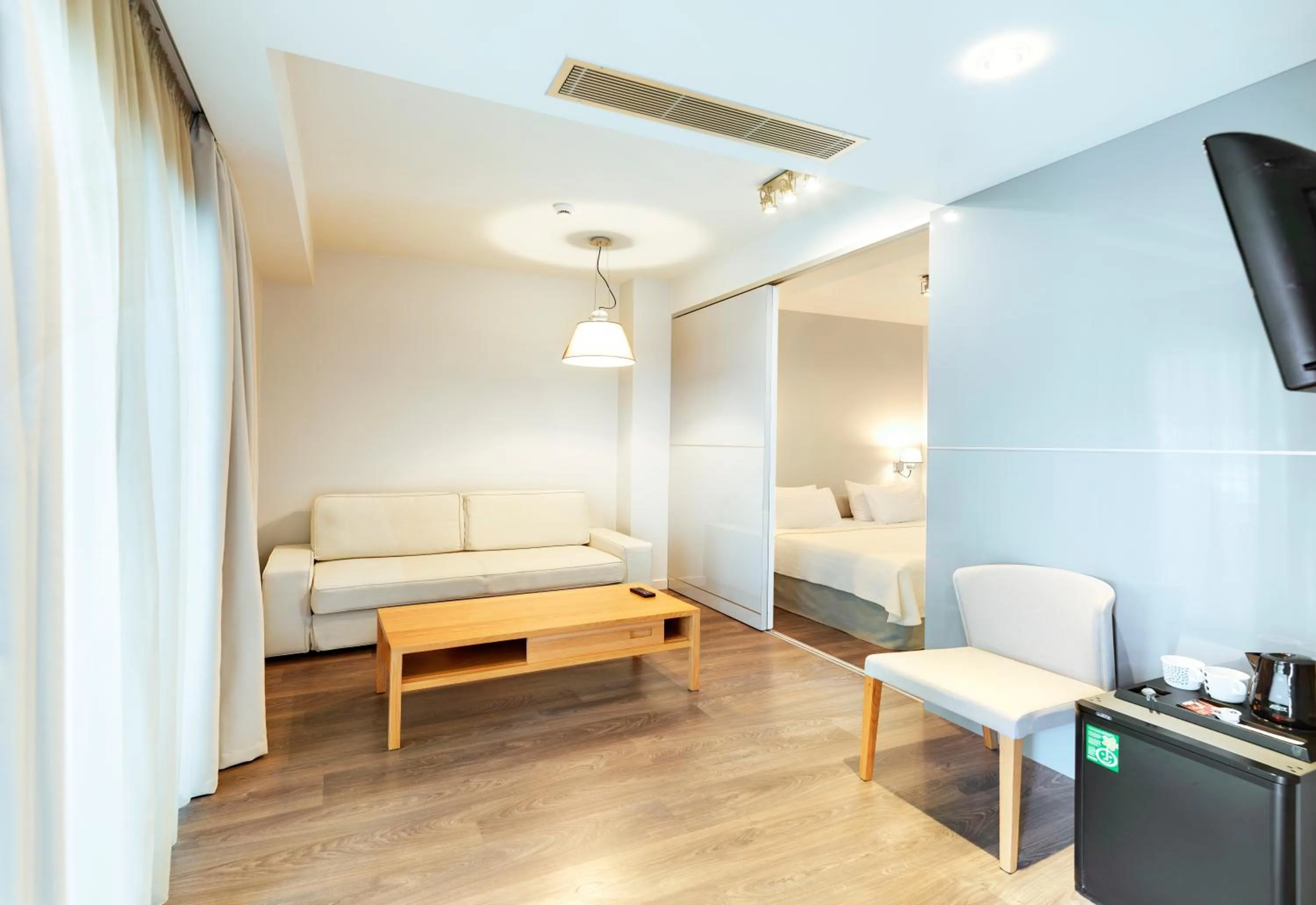 Living room, Bed in Phidias Piraeus Hotel