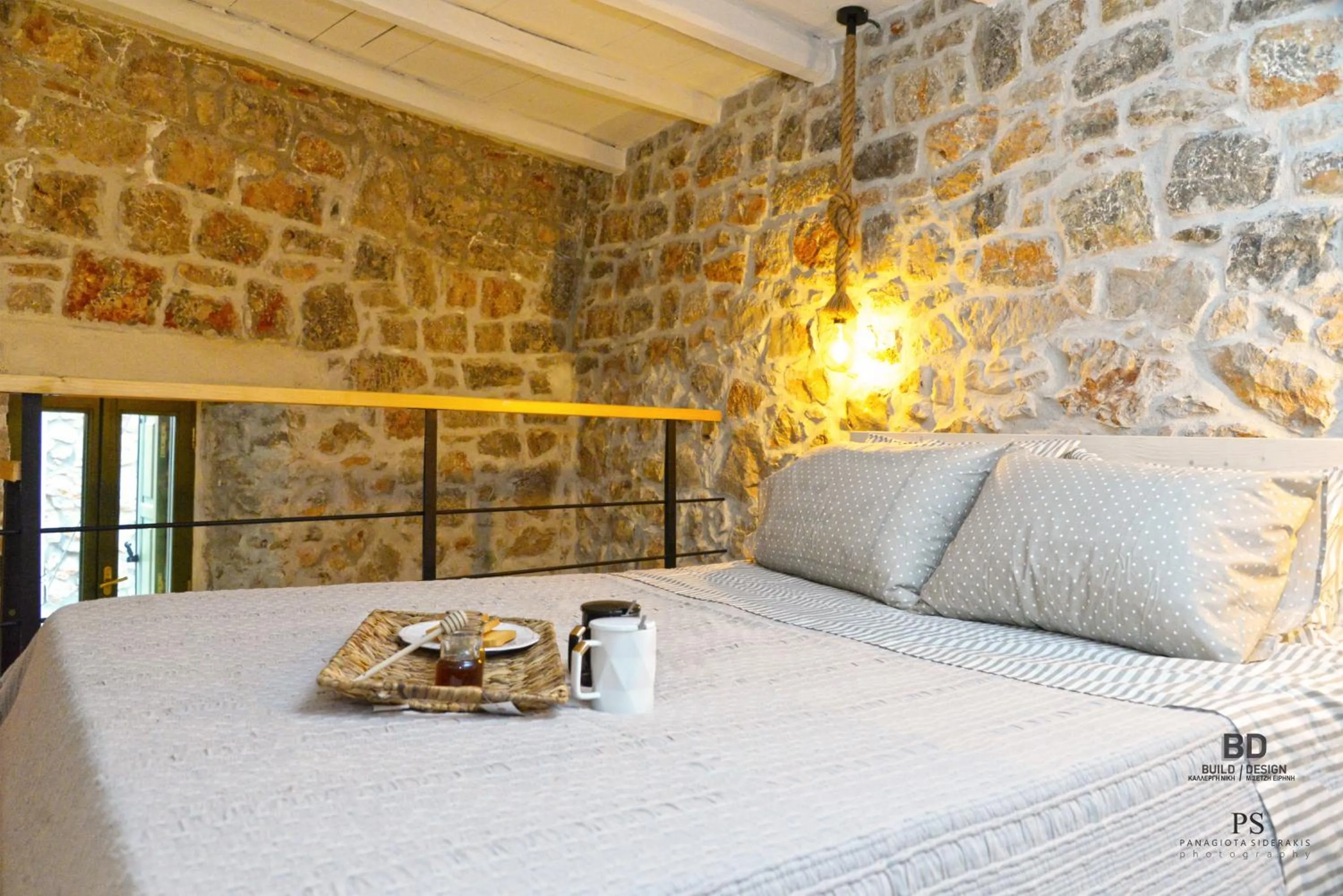 Bed in Pyrgos Houses and Restaurant