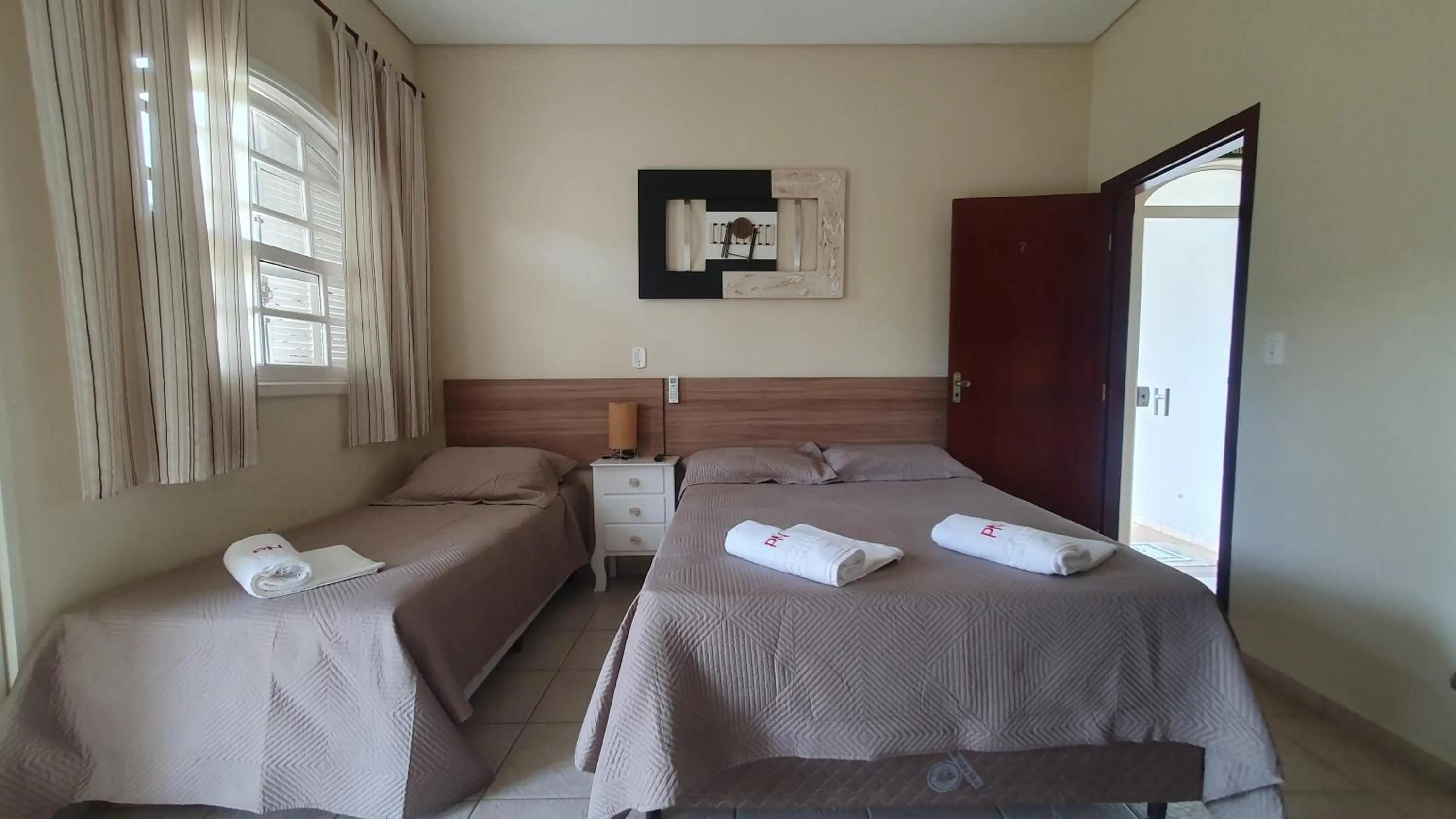 Bed in Pousada Nefelibatas