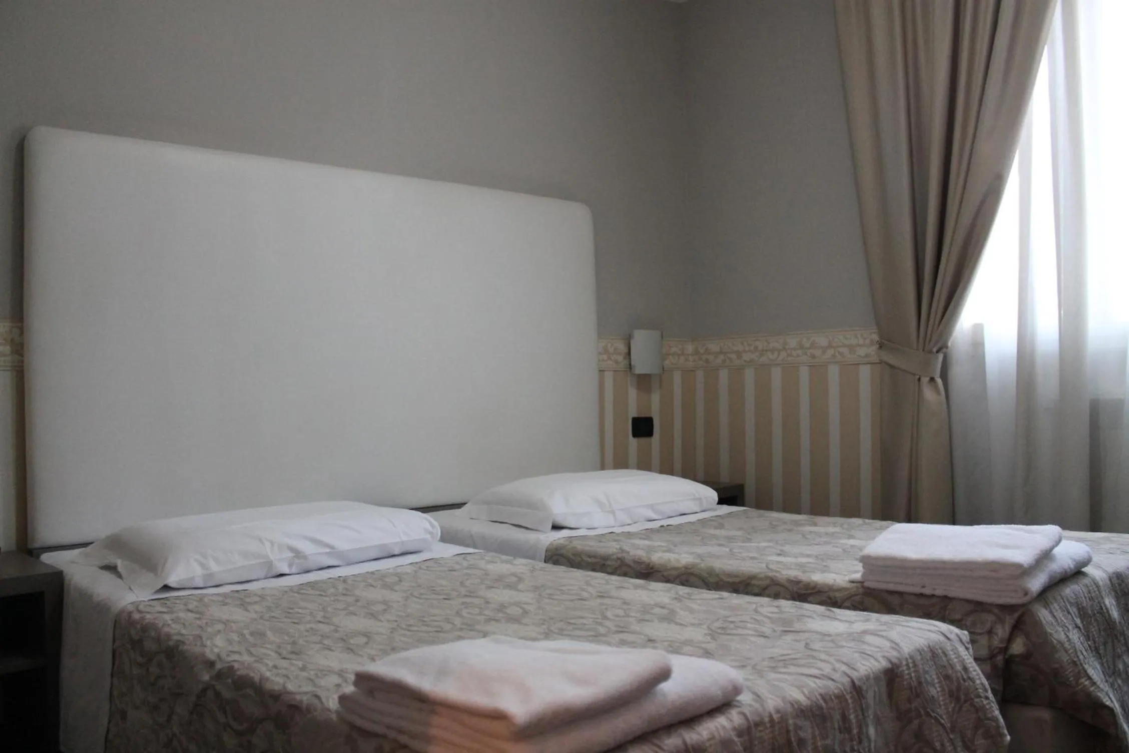 Bed in Hotel Laguna Residence