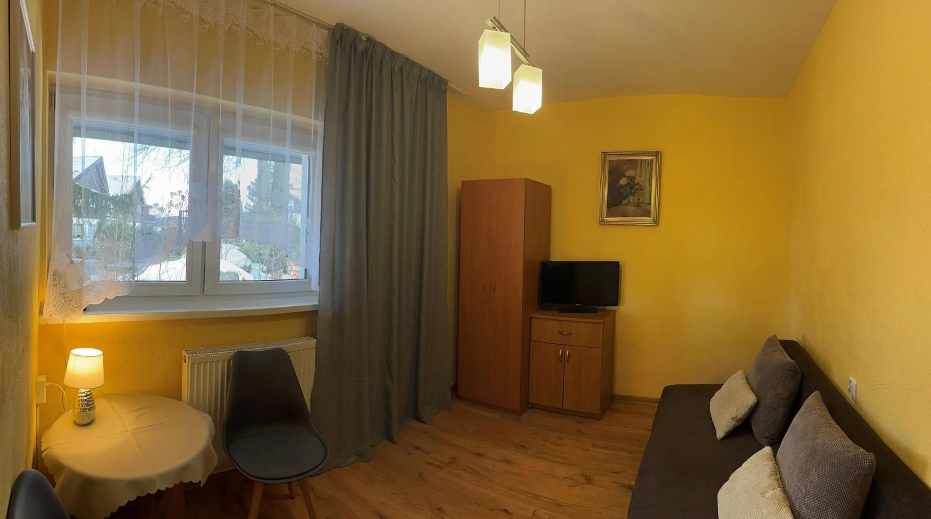 Communal lounge/ TV room in Dom wczasowy Przy Skałkach