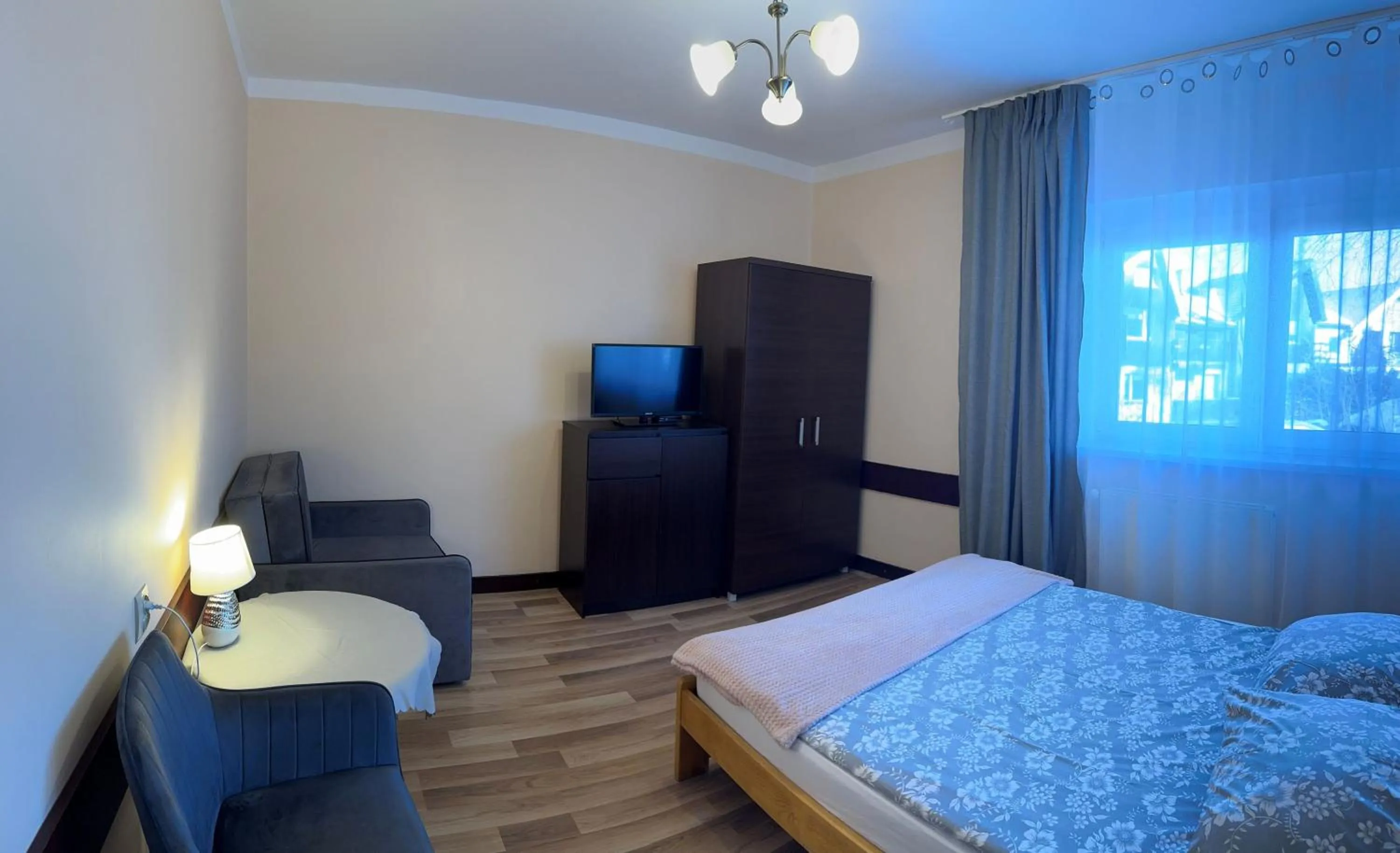 Communal lounge/ TV room, Bed in Dom wczasowy Przy Skałkach