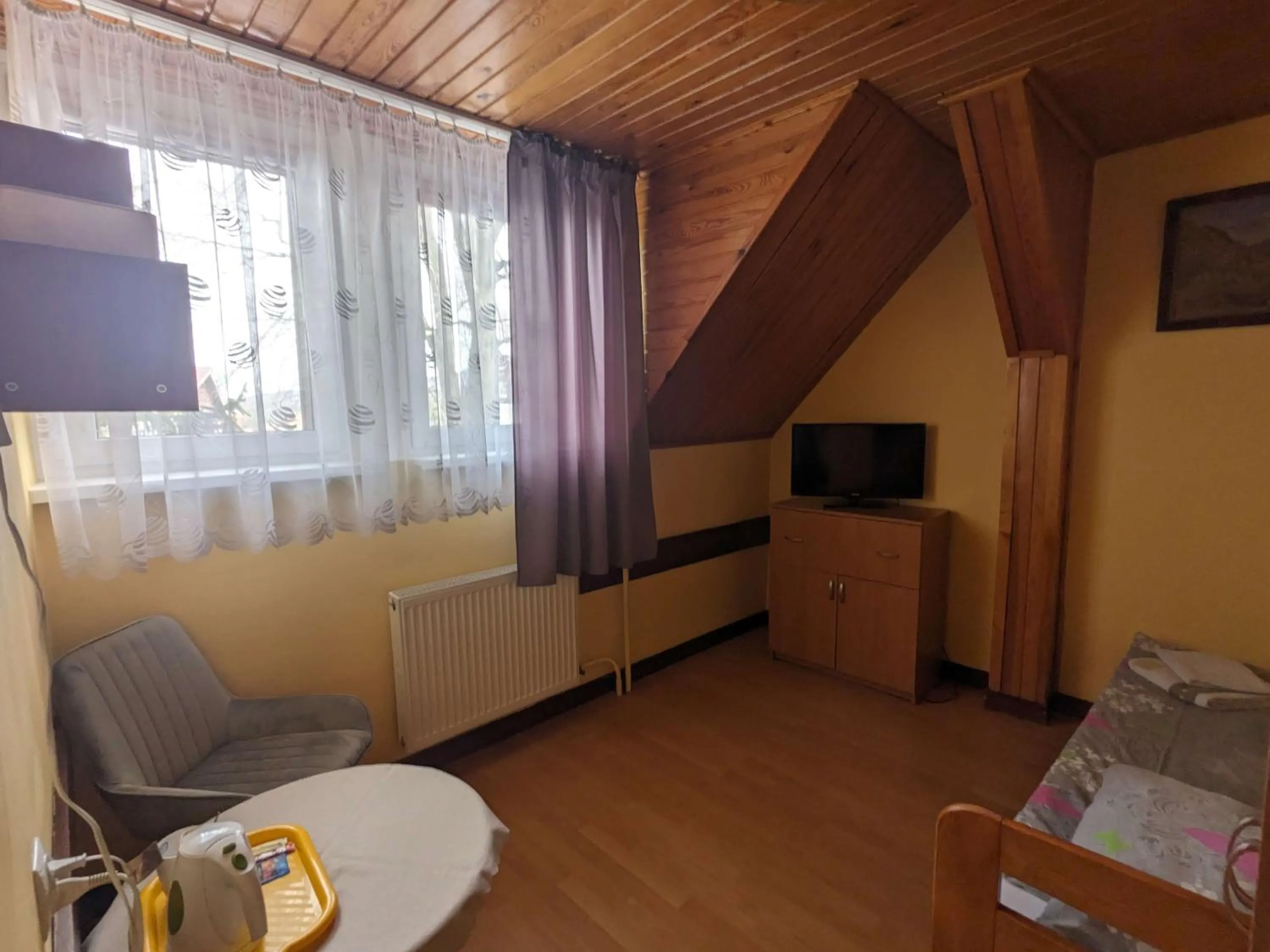 Communal lounge/ TV room in Dom wczasowy Przy Skałkach