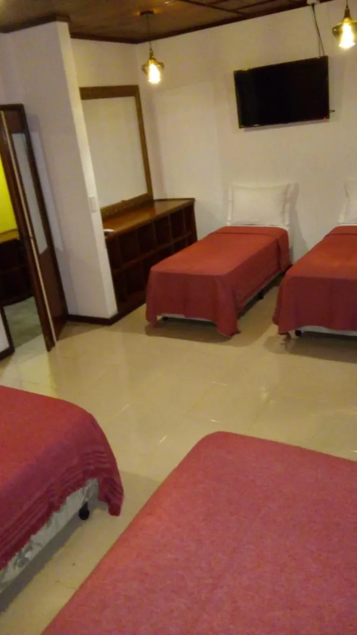 Bed in El Uru Suite Hotel