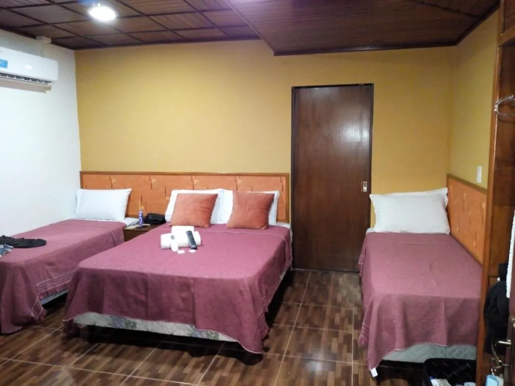 Bed in El Uru Suite Hotel