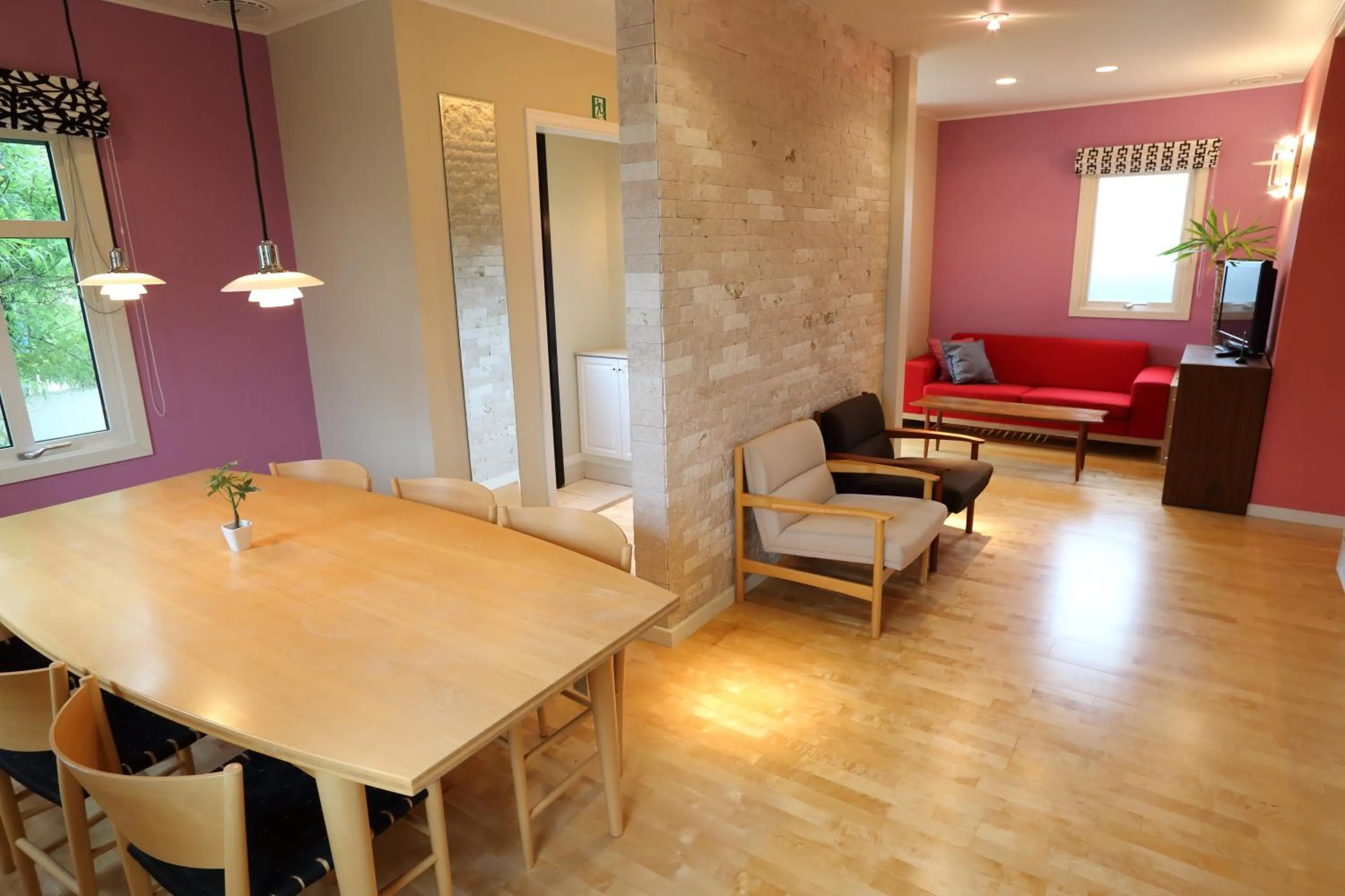 Dining area in Tabinoteitaku Kamakura Yuigahama -Homann Concept-