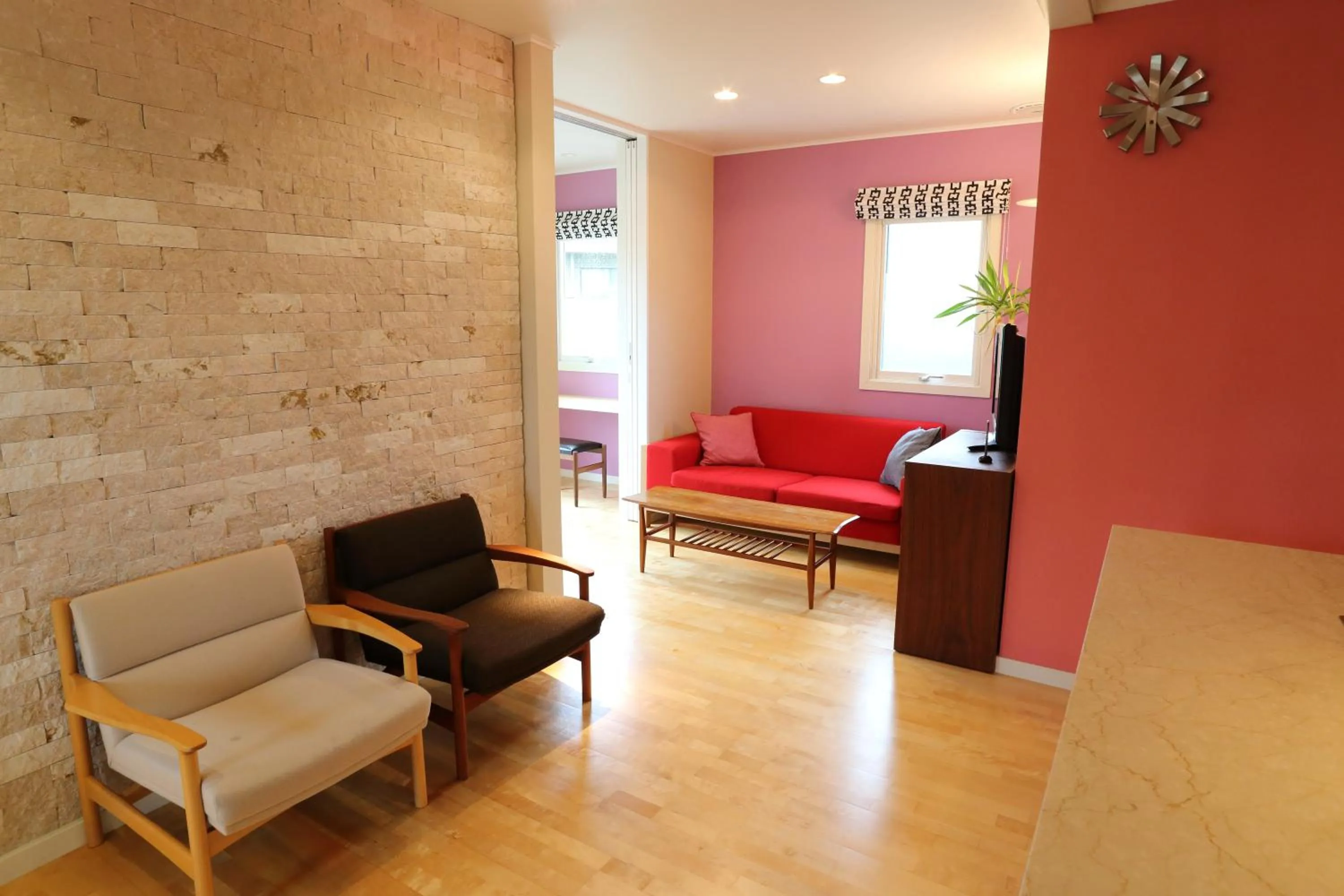 Living room in Tabinoteitaku Kamakura Yuigahama -Homann Concept-