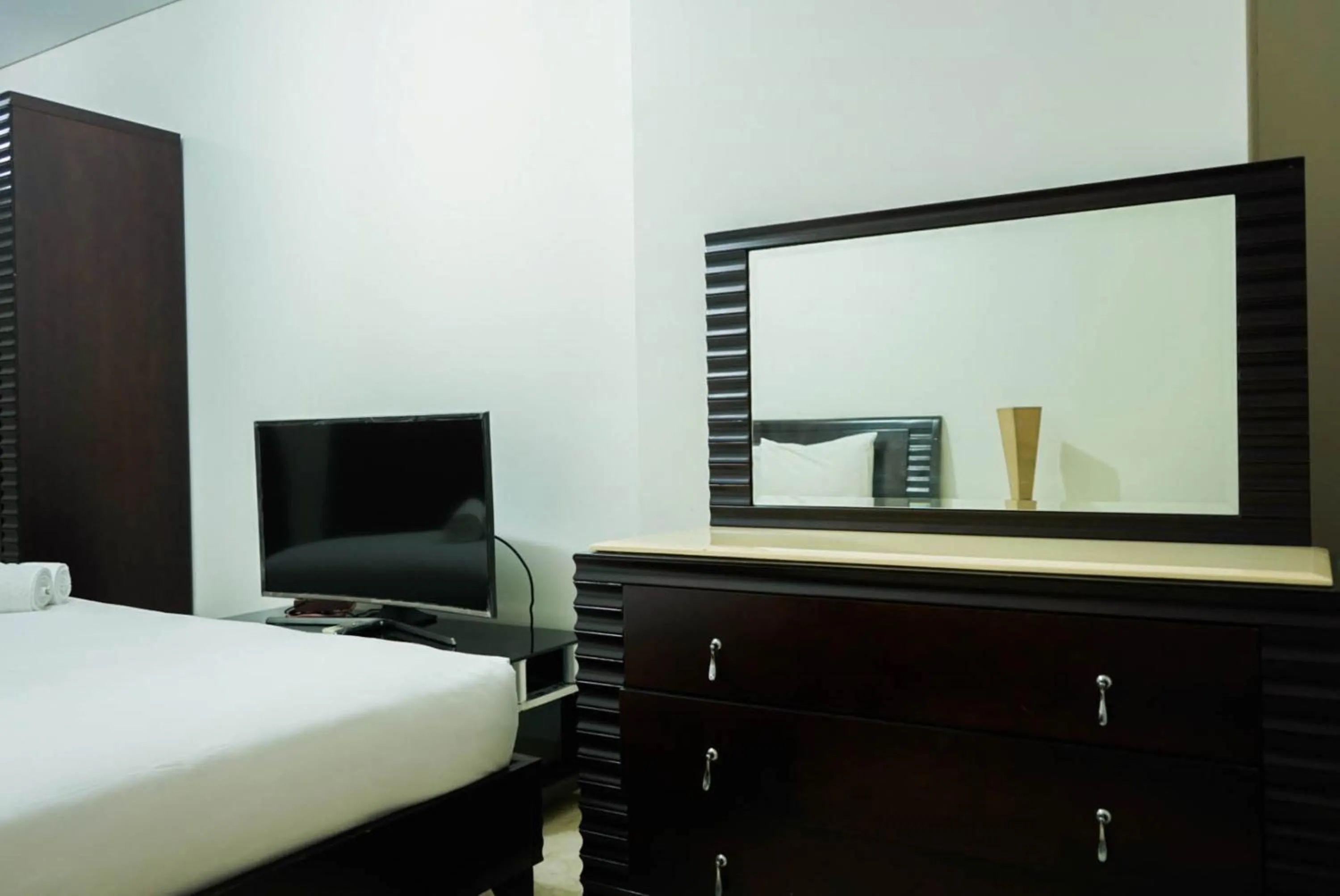 Bed in 2BR with Study Room at L'Avenue Apartment By Travelio