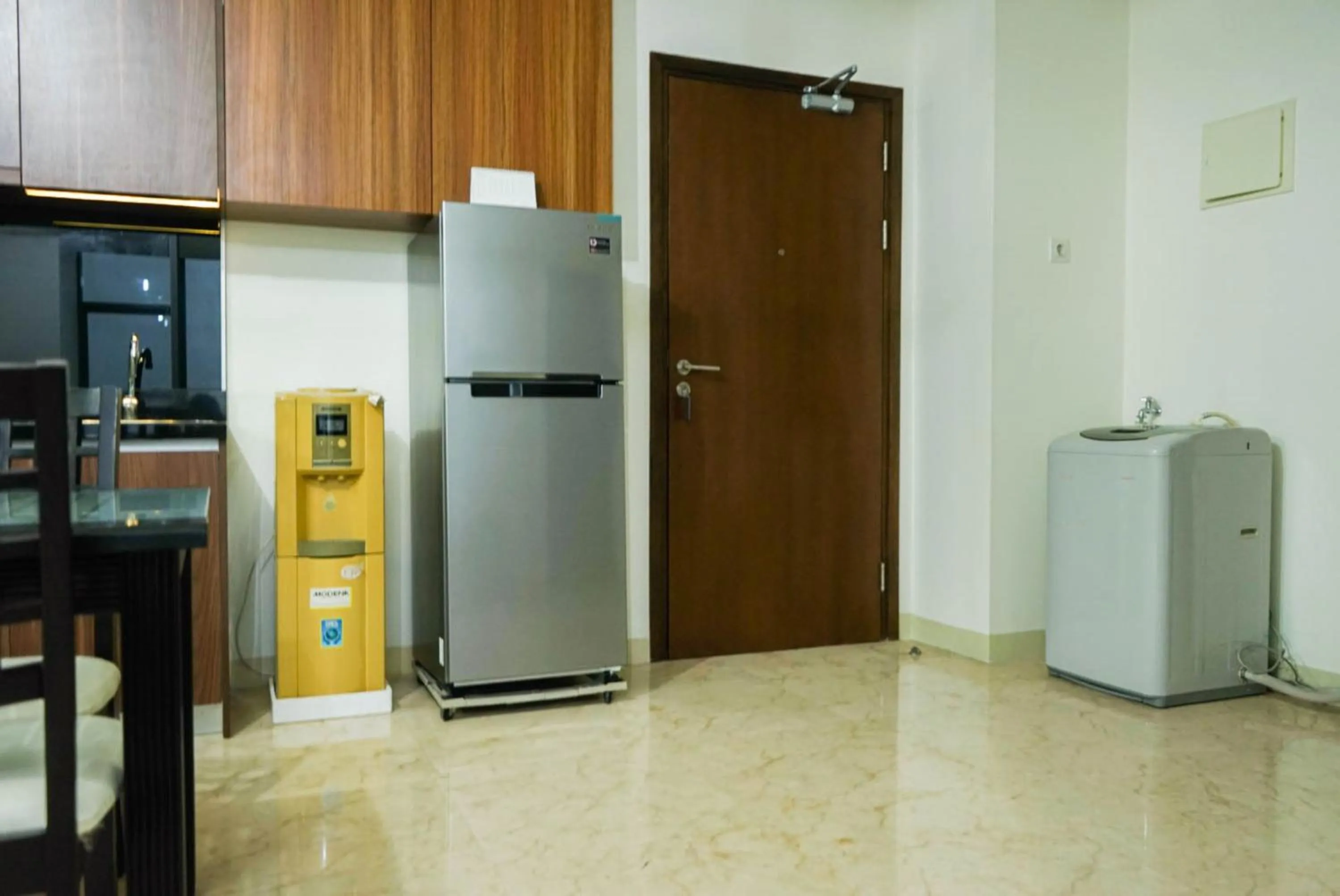 Kitchen or kitchenette in 2BR with Study Room at L'Avenue Apartment By Travelio