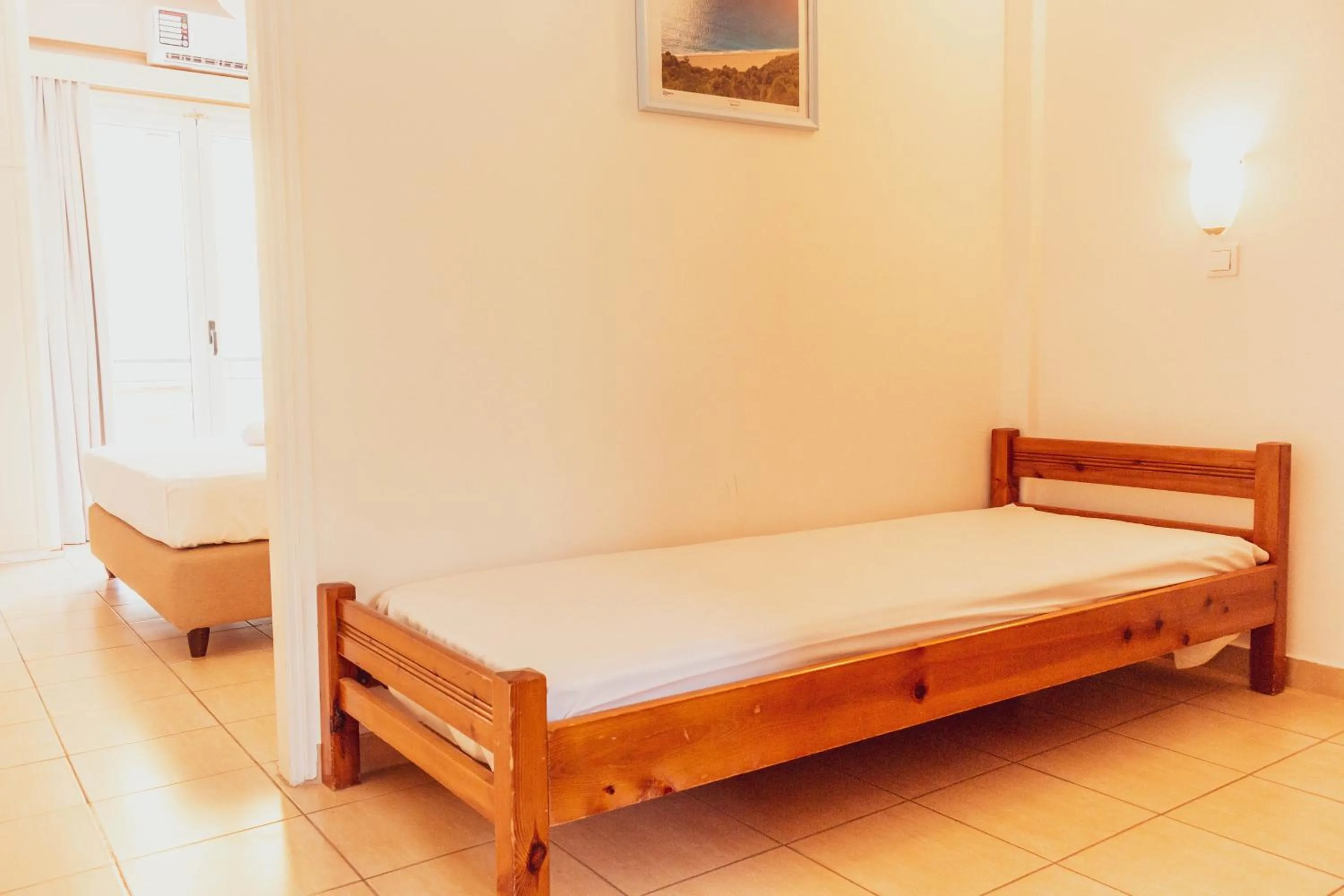 Bed in Apagio Apartments