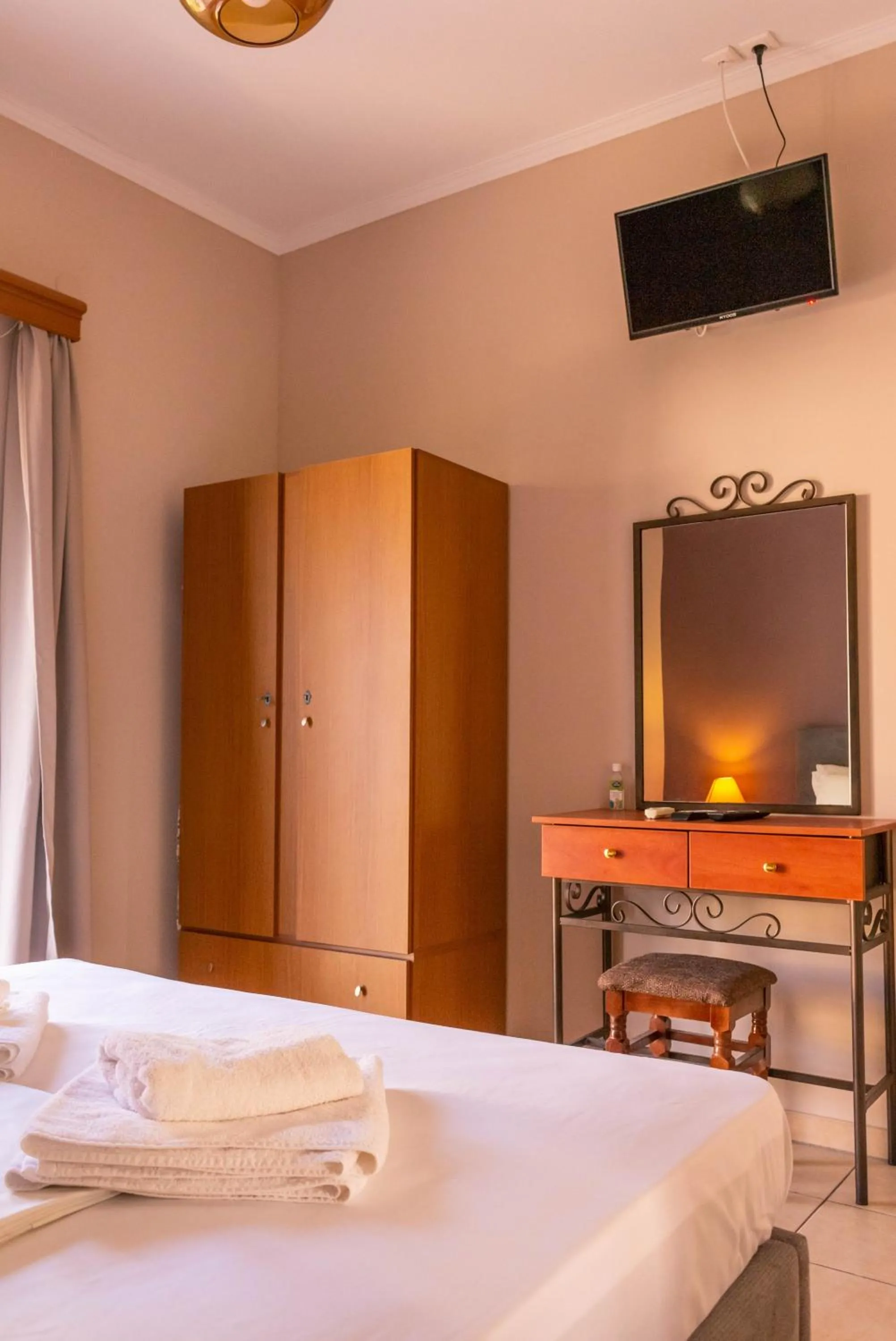 Bed in Apagio Apartments