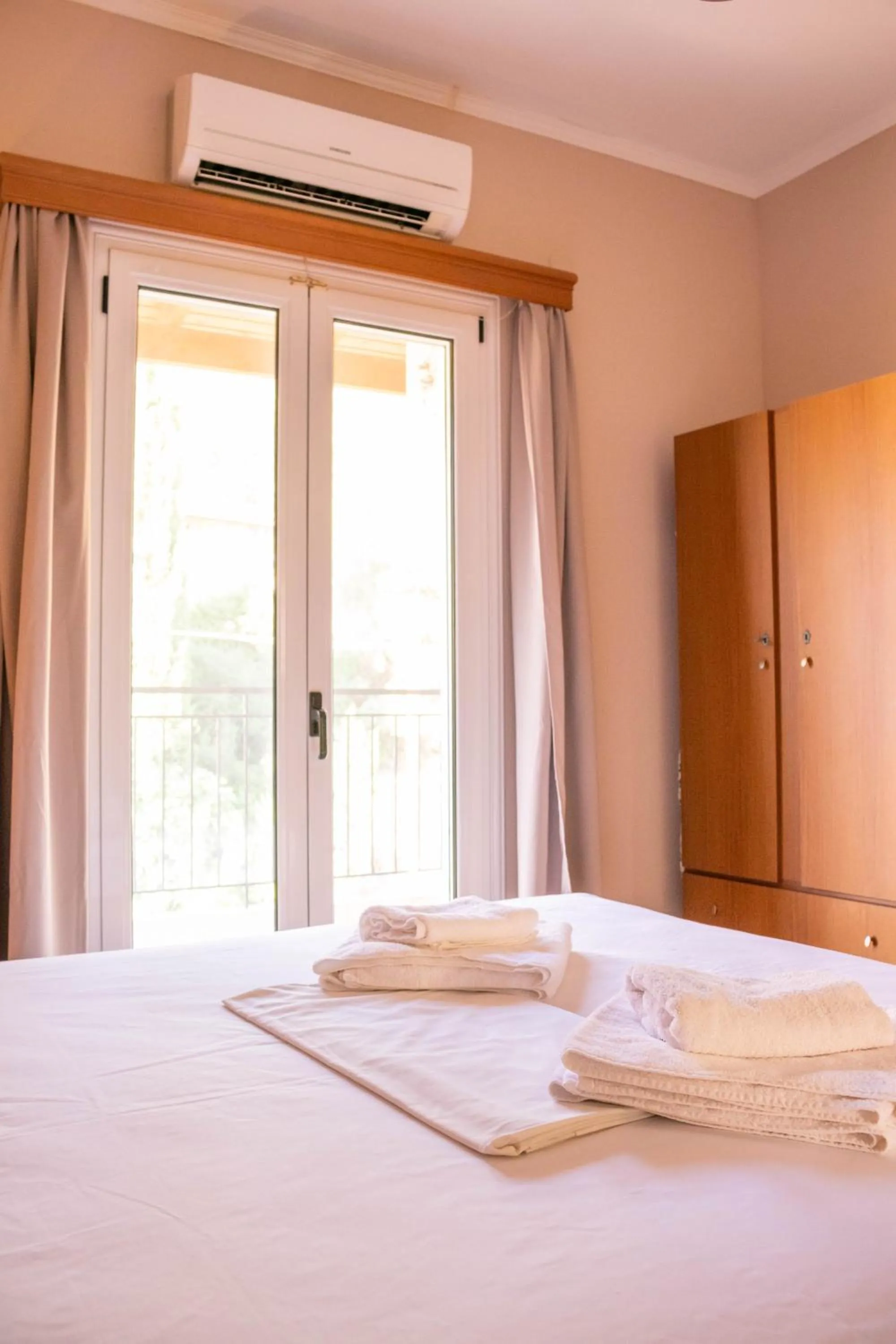 Bed in Apagio Apartments