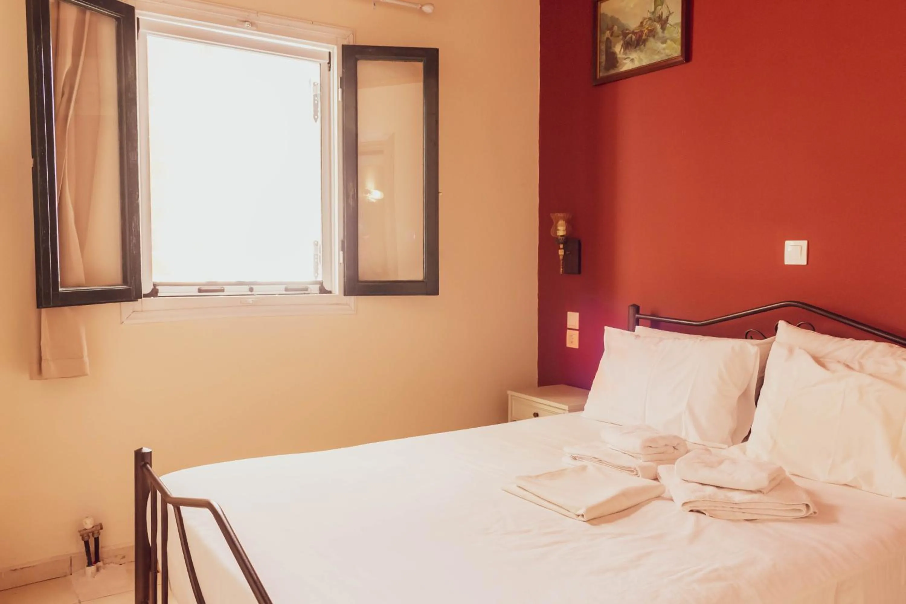 Bed in Apagio Apartments