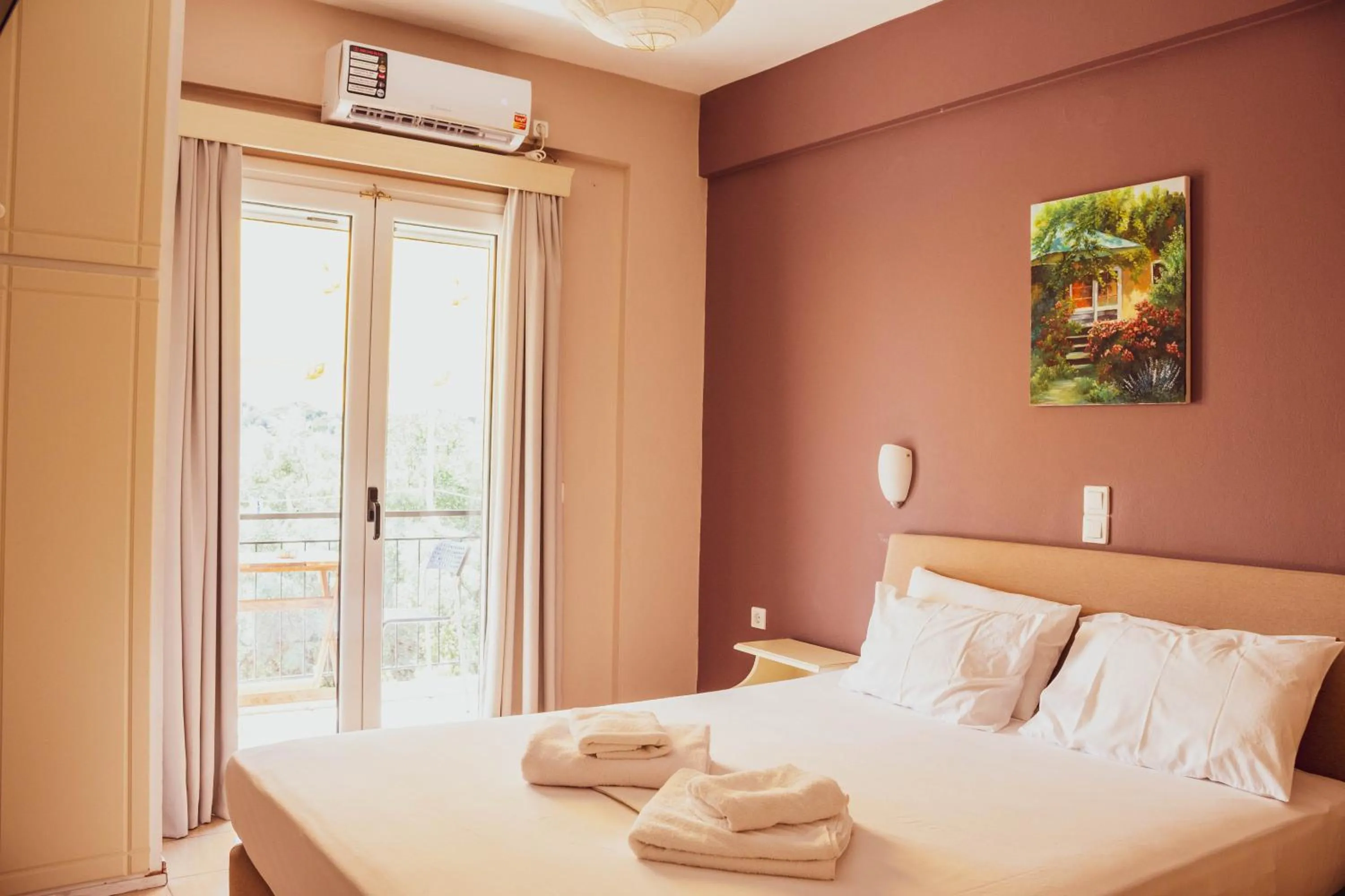Bed in Apagio Apartments