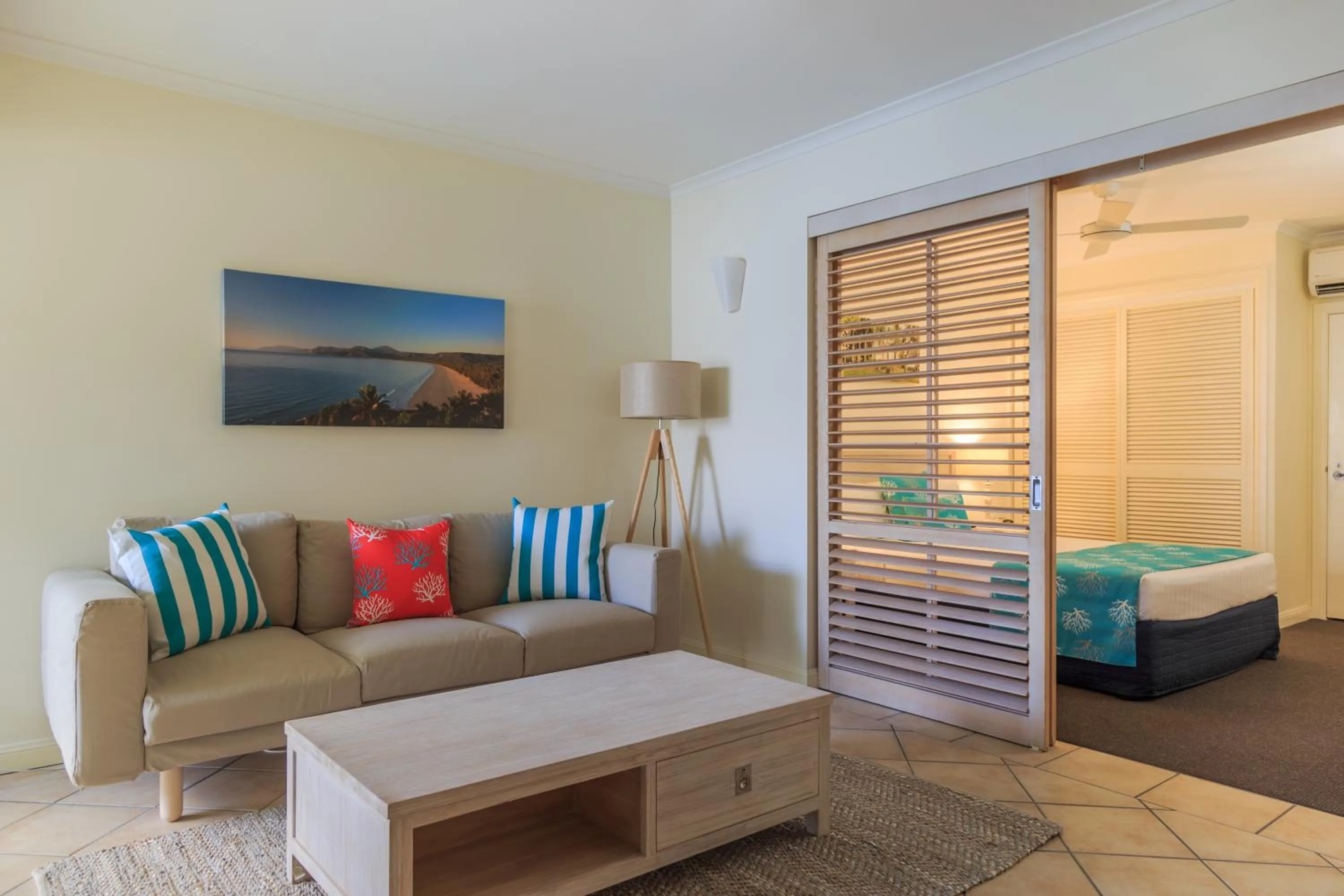 Living room, Bed in Macrossan House Boutique Holiday Apartments