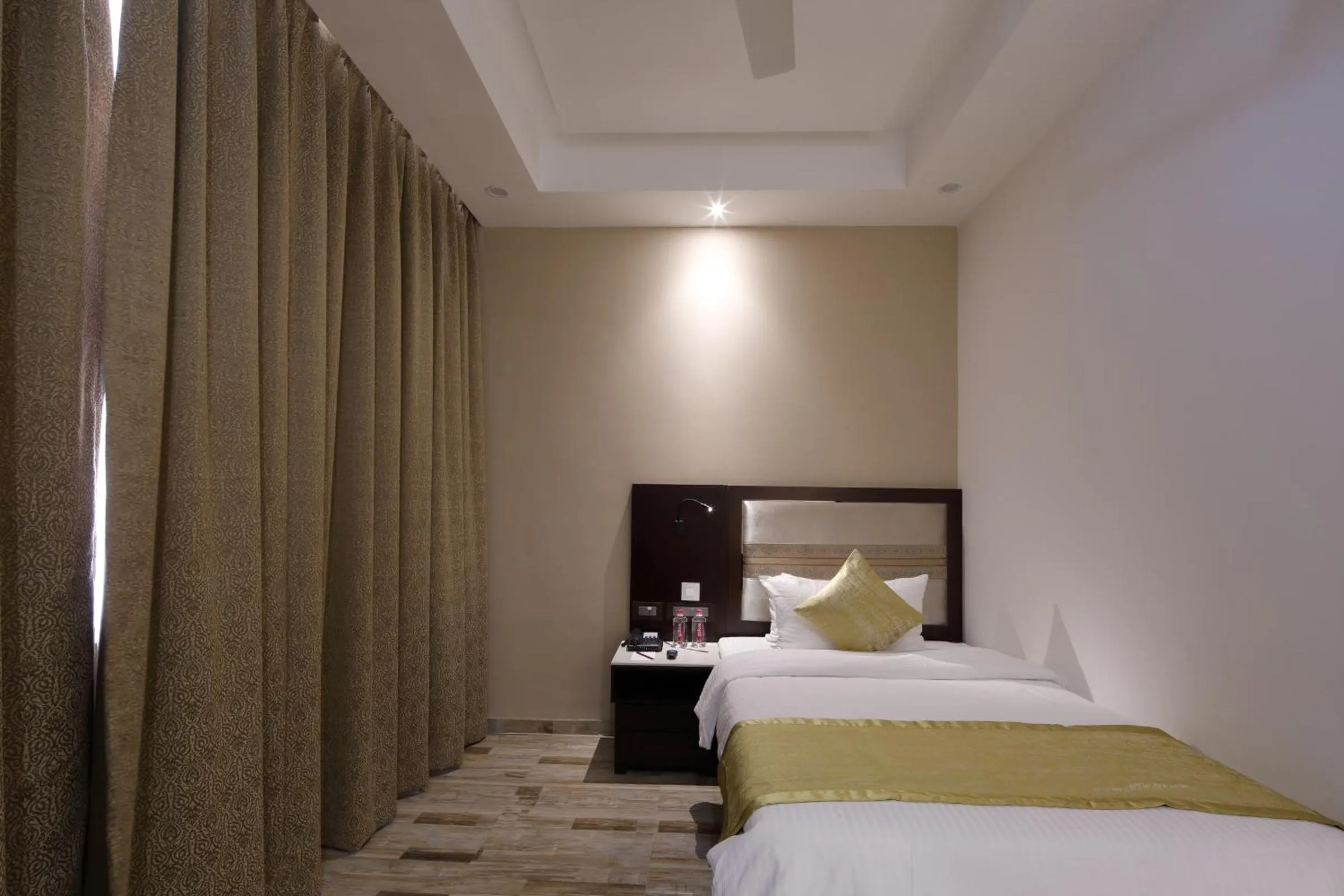 Bedroom, Bed in Regenta Inn Ranip Ahmedabad
