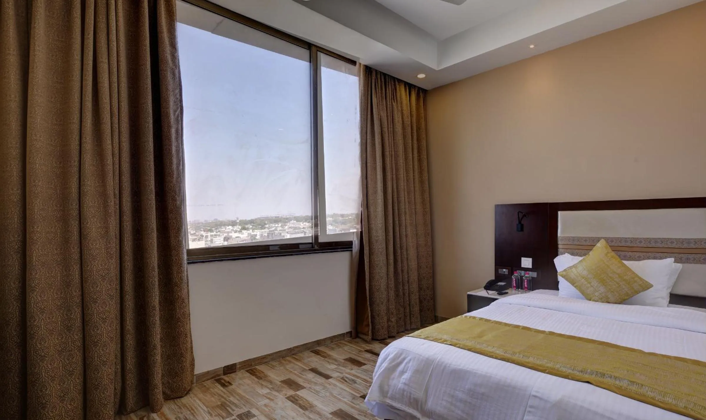 Bedroom, Bed in Regenta Inn Ranip Ahmedabad
