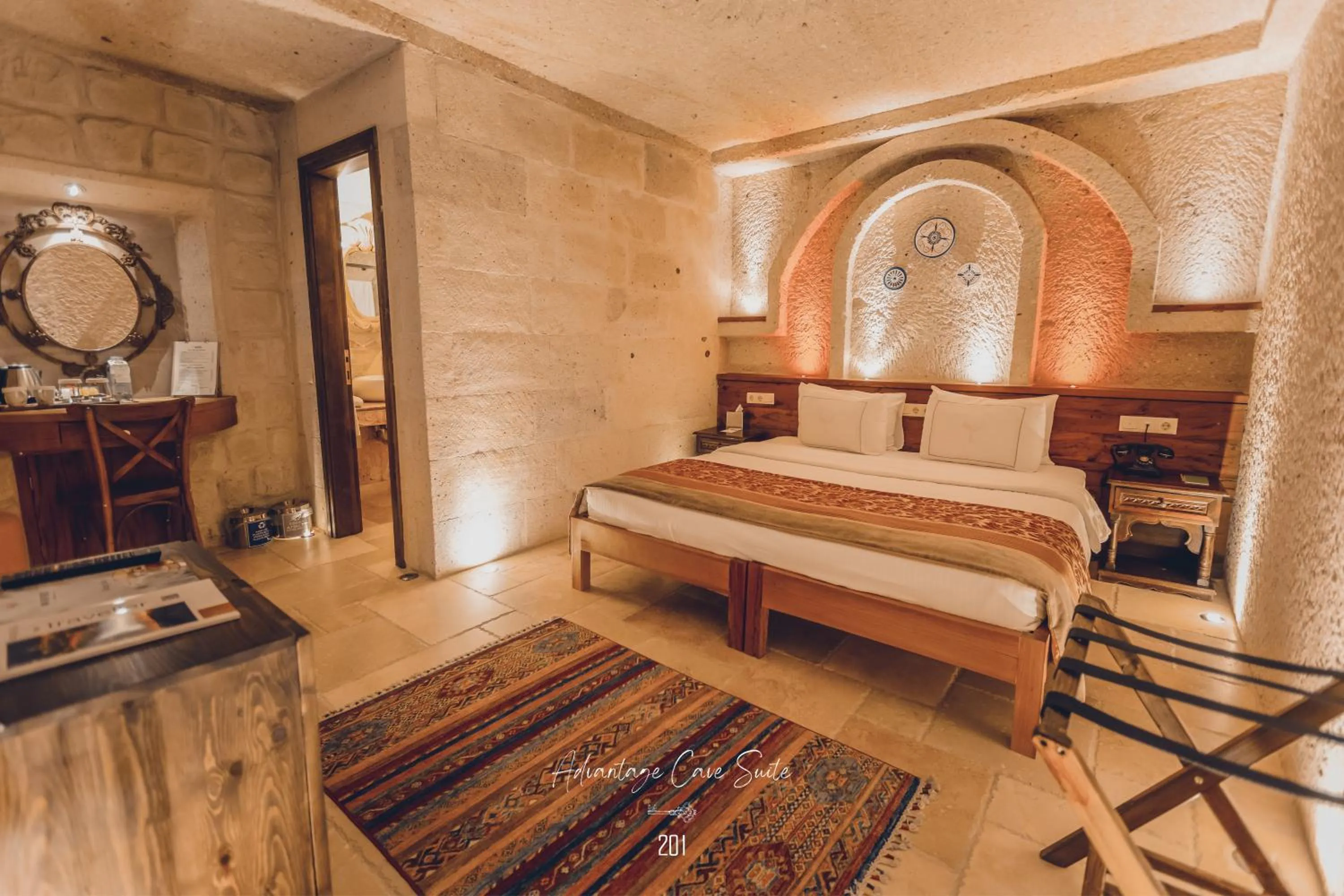 Bed in Nino Cave Suites