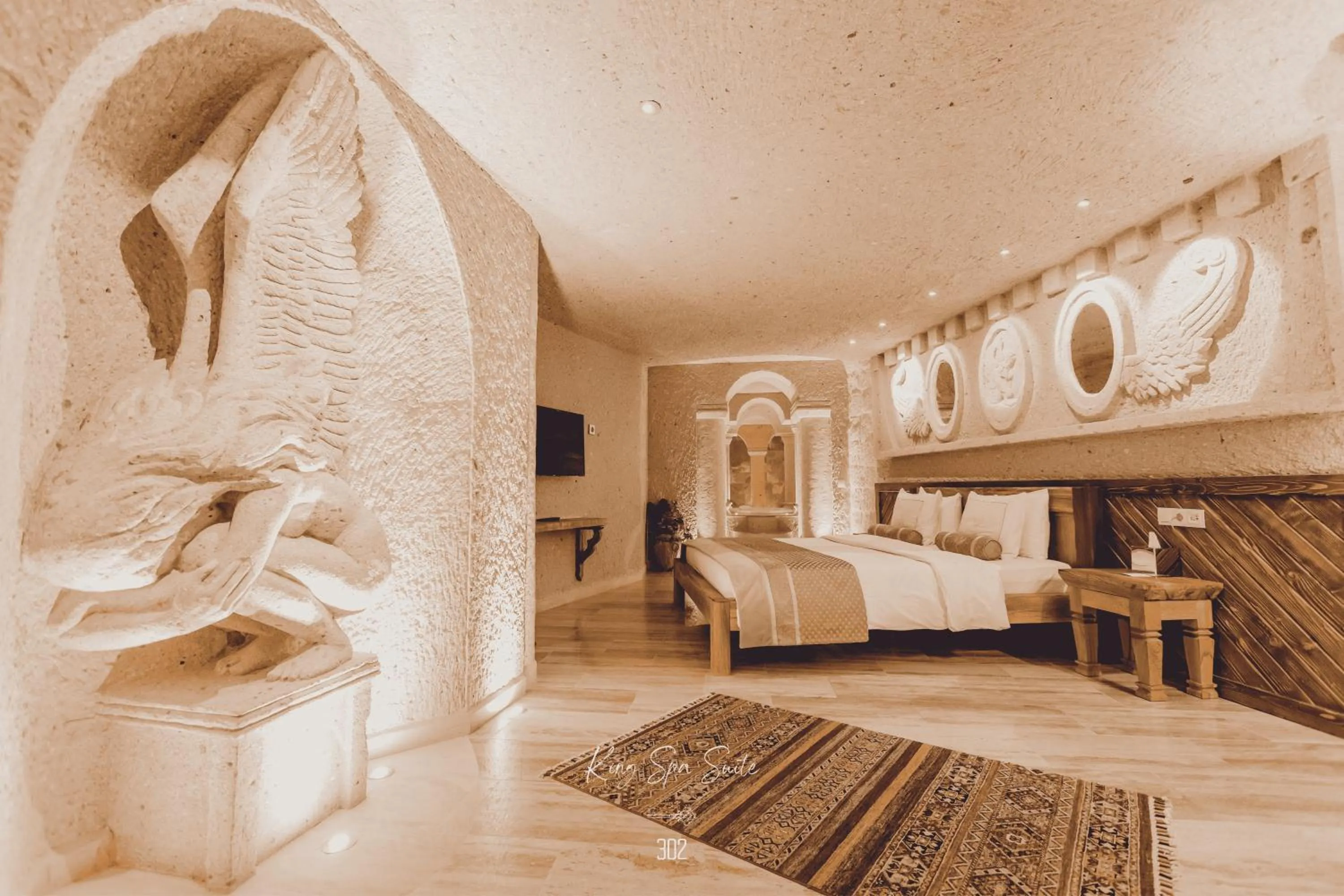 Photo of the whole room, Bed in Nino Cave Suites