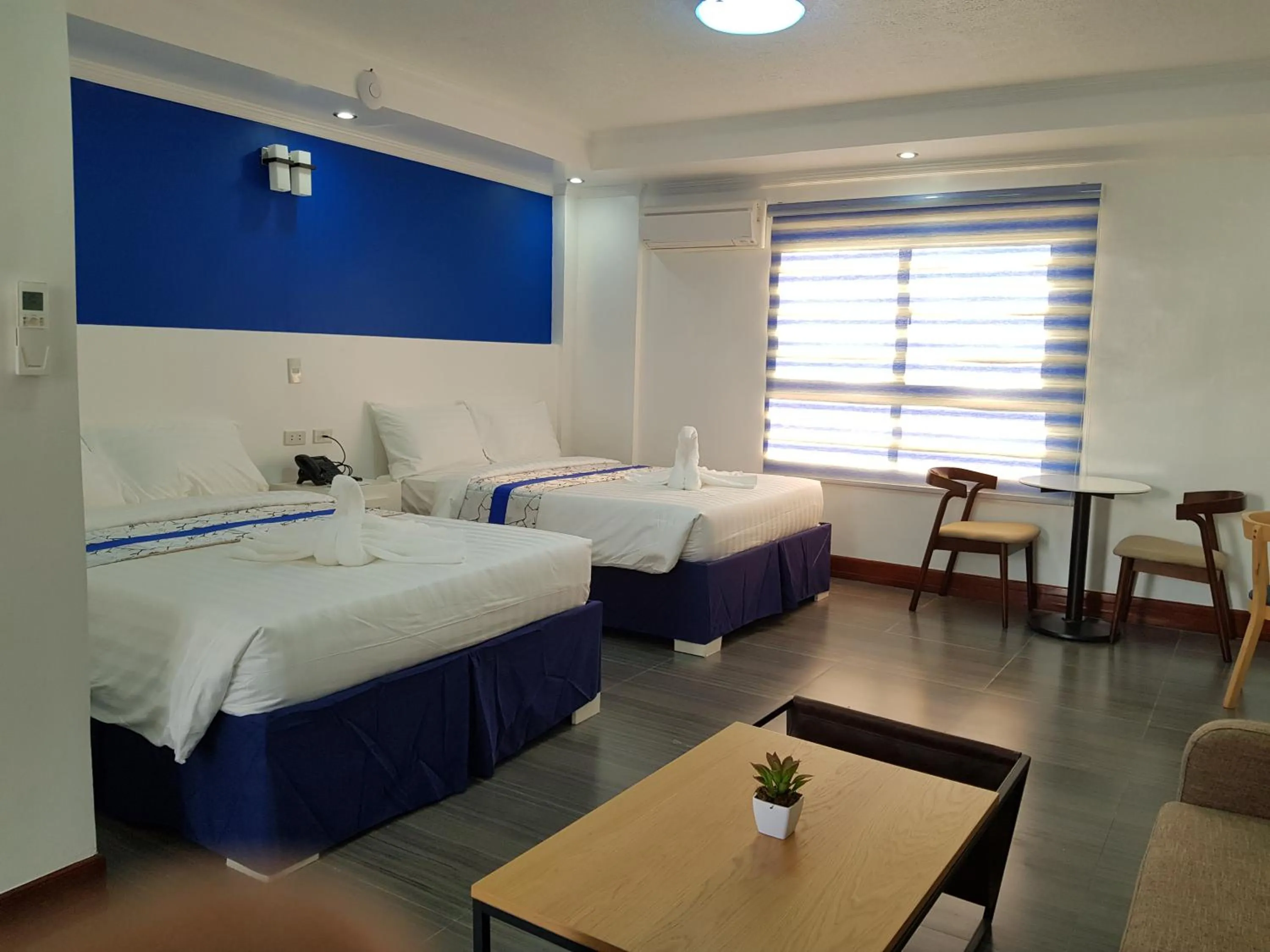 Photo of the whole room, Bed in Santiago Cove Hotel and Restaurant