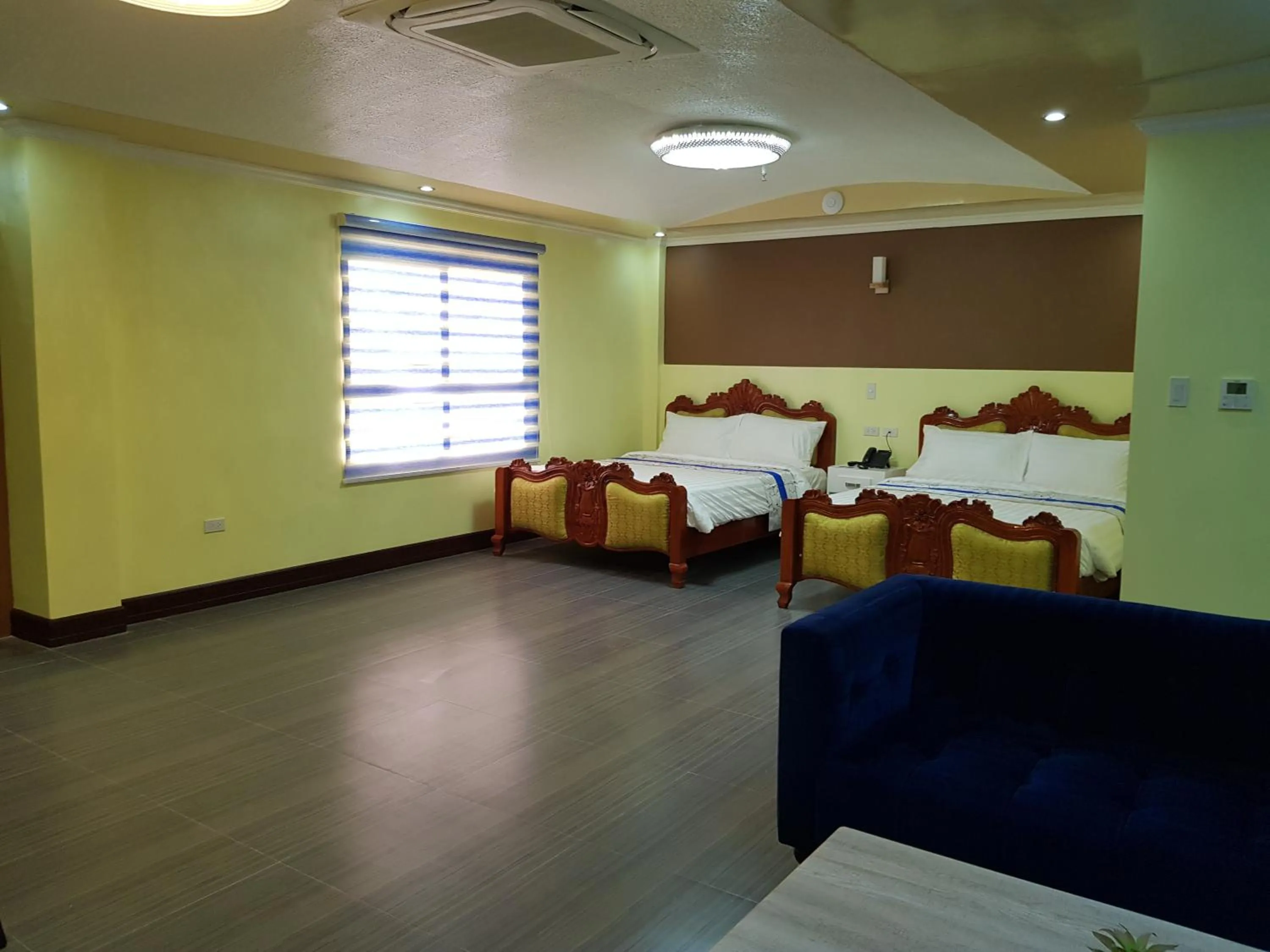 Bed in Santiago Cove Hotel and Restaurant