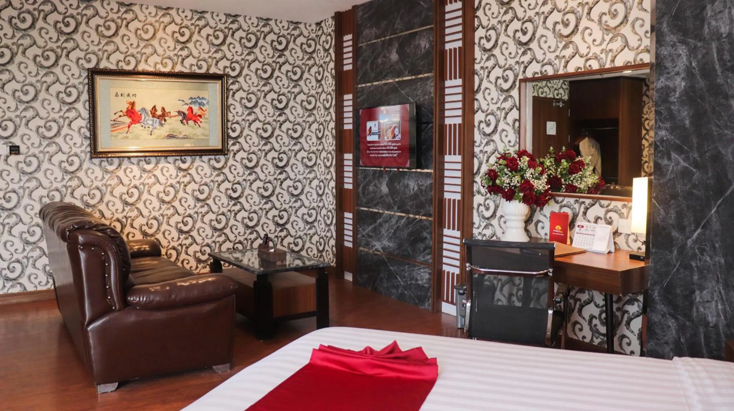 Seating area, Bed in Pakons Prime Hotel