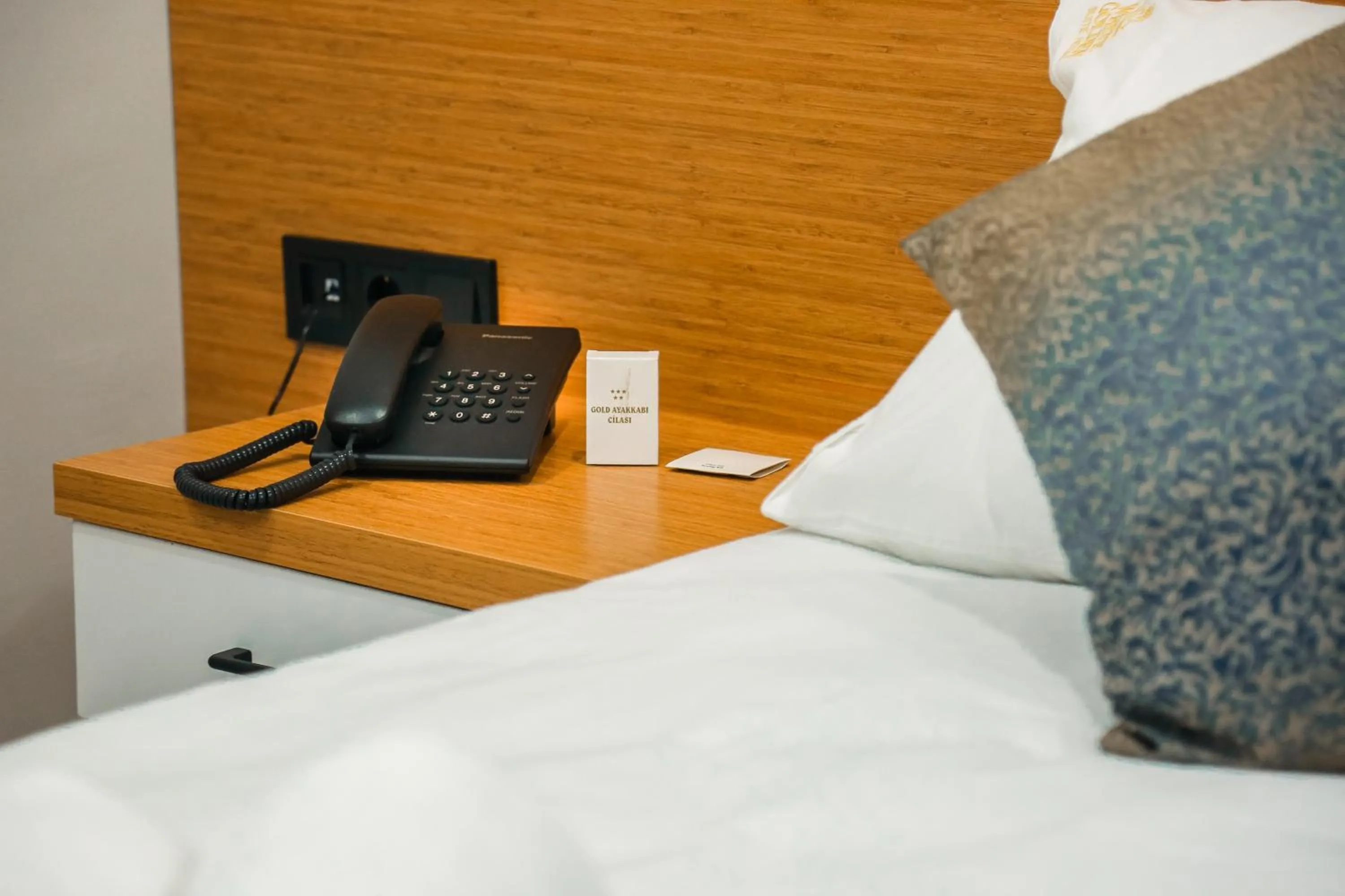 Bed in White Golden Suite Hotel